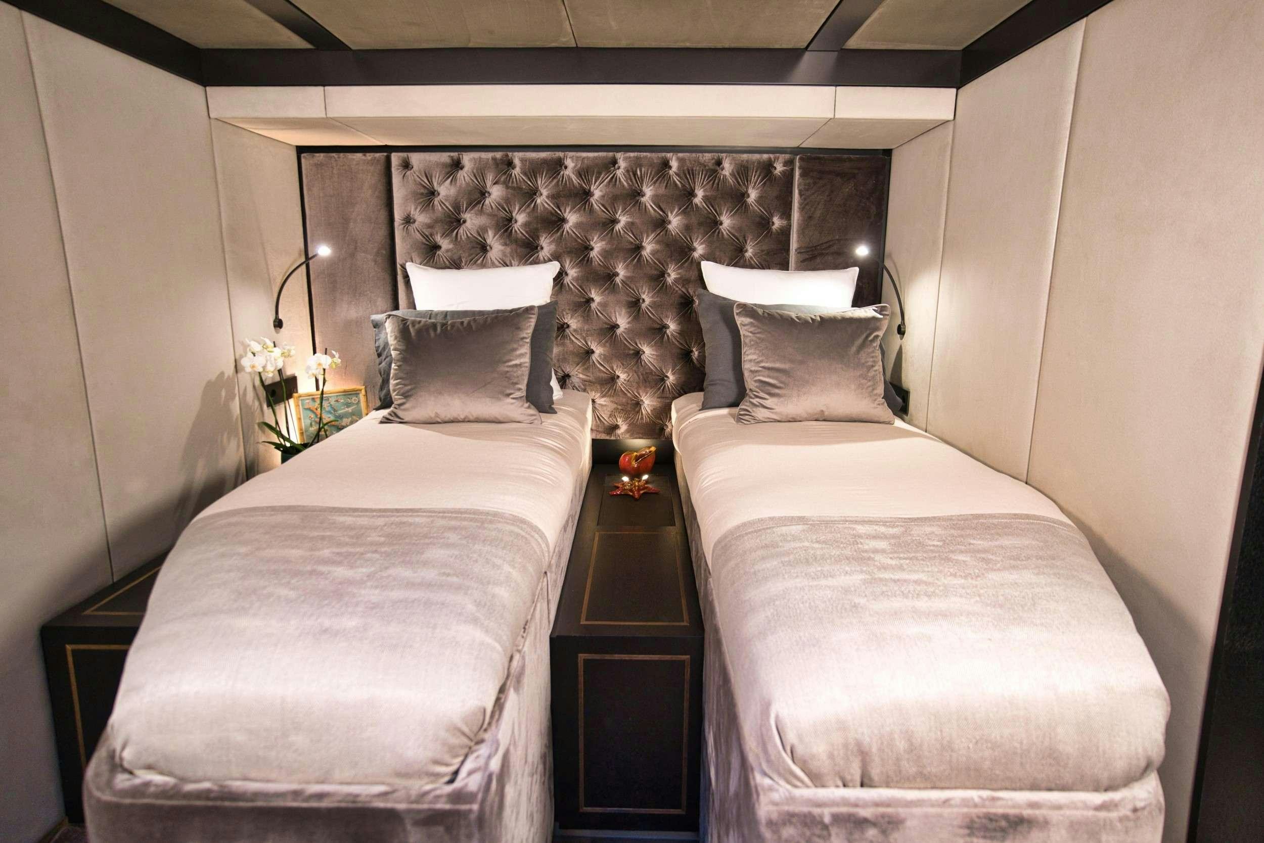 a couple of beds in a room aboard GINETTE Yacht for Charter