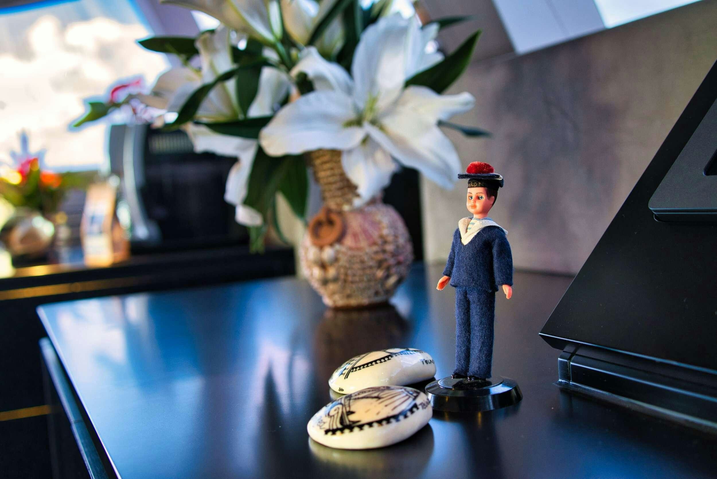a vase with a flower on it aboard GINETTE Yacht for Charter