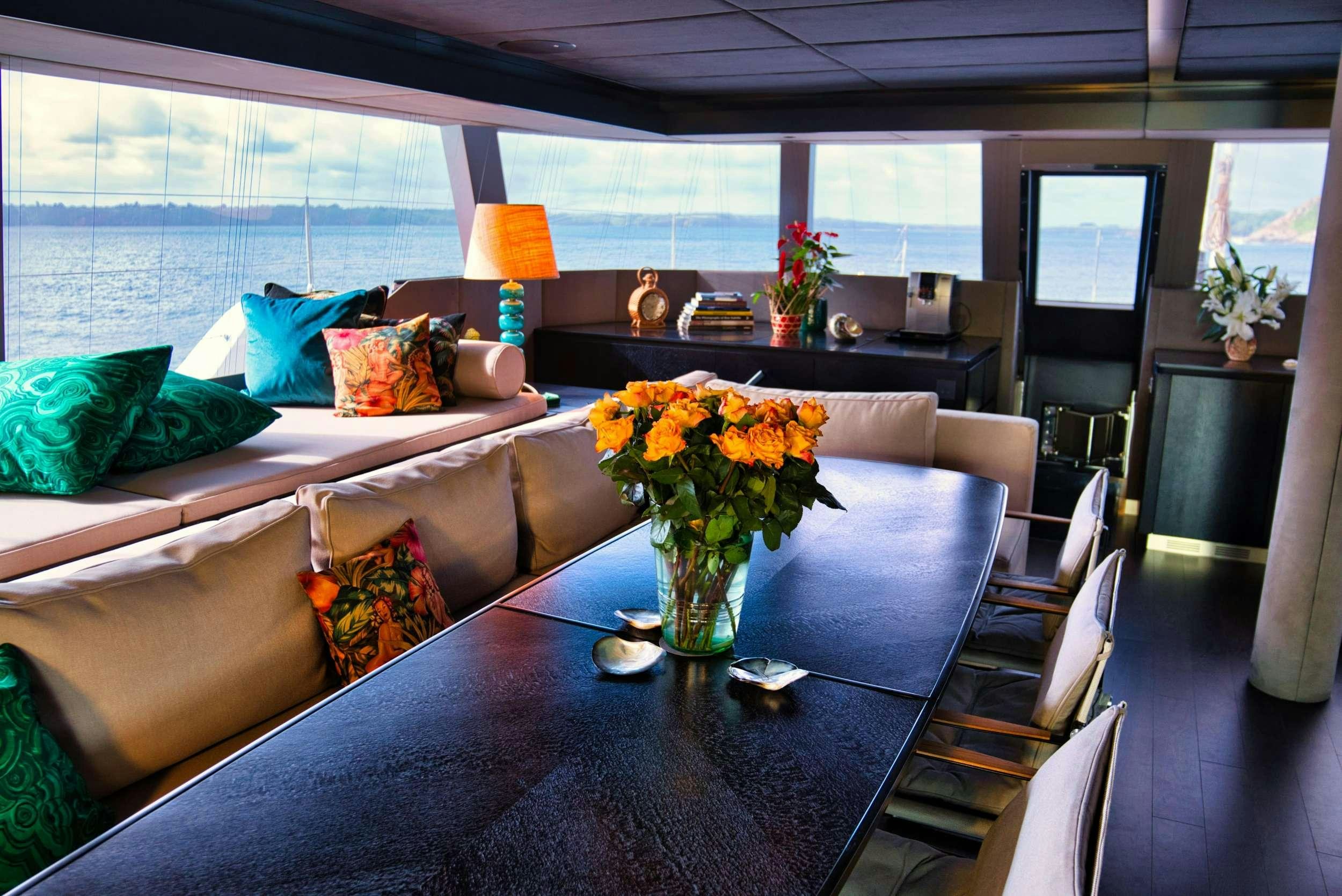 a living room with a couch and a table aboard GINETTE Yacht for Charter