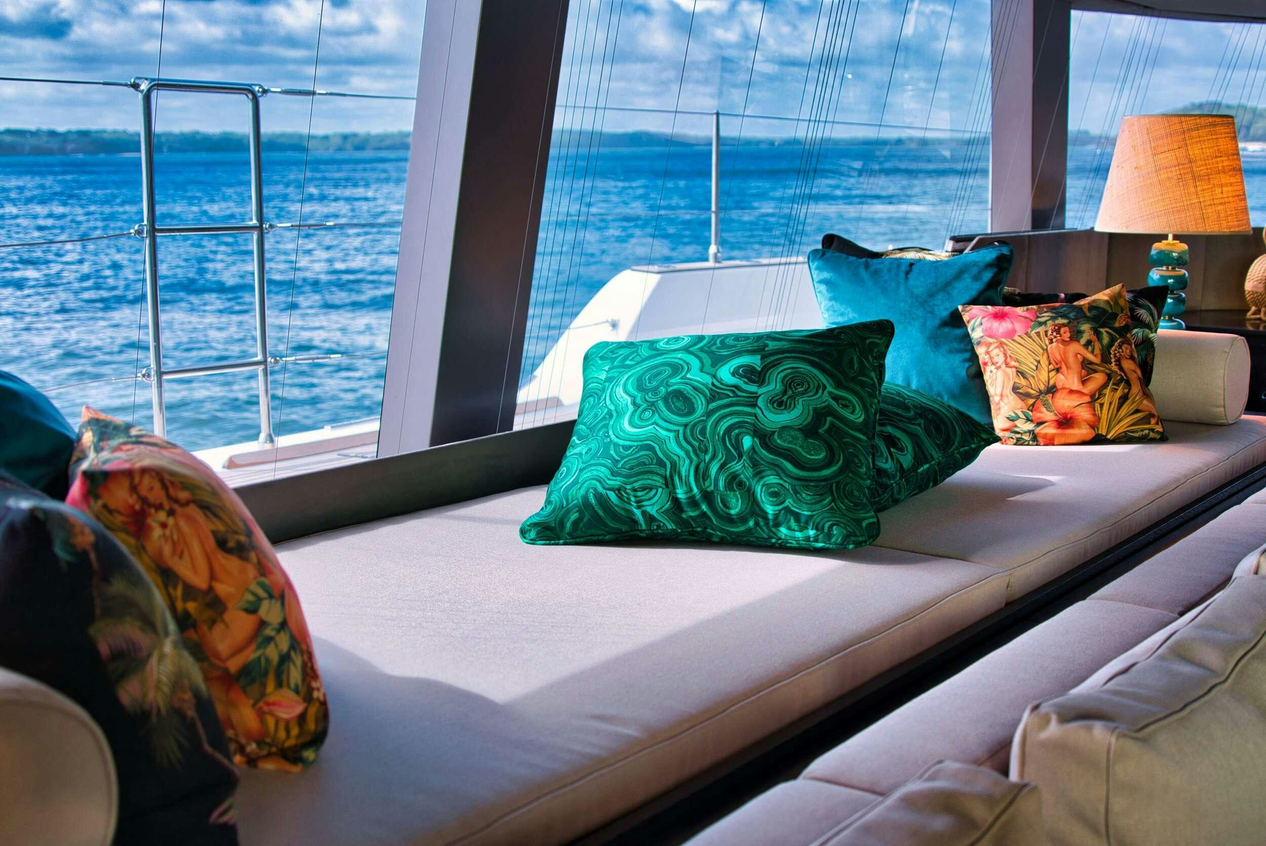 a bed with pillows and pillows aboard GINETTE Yacht for Charter