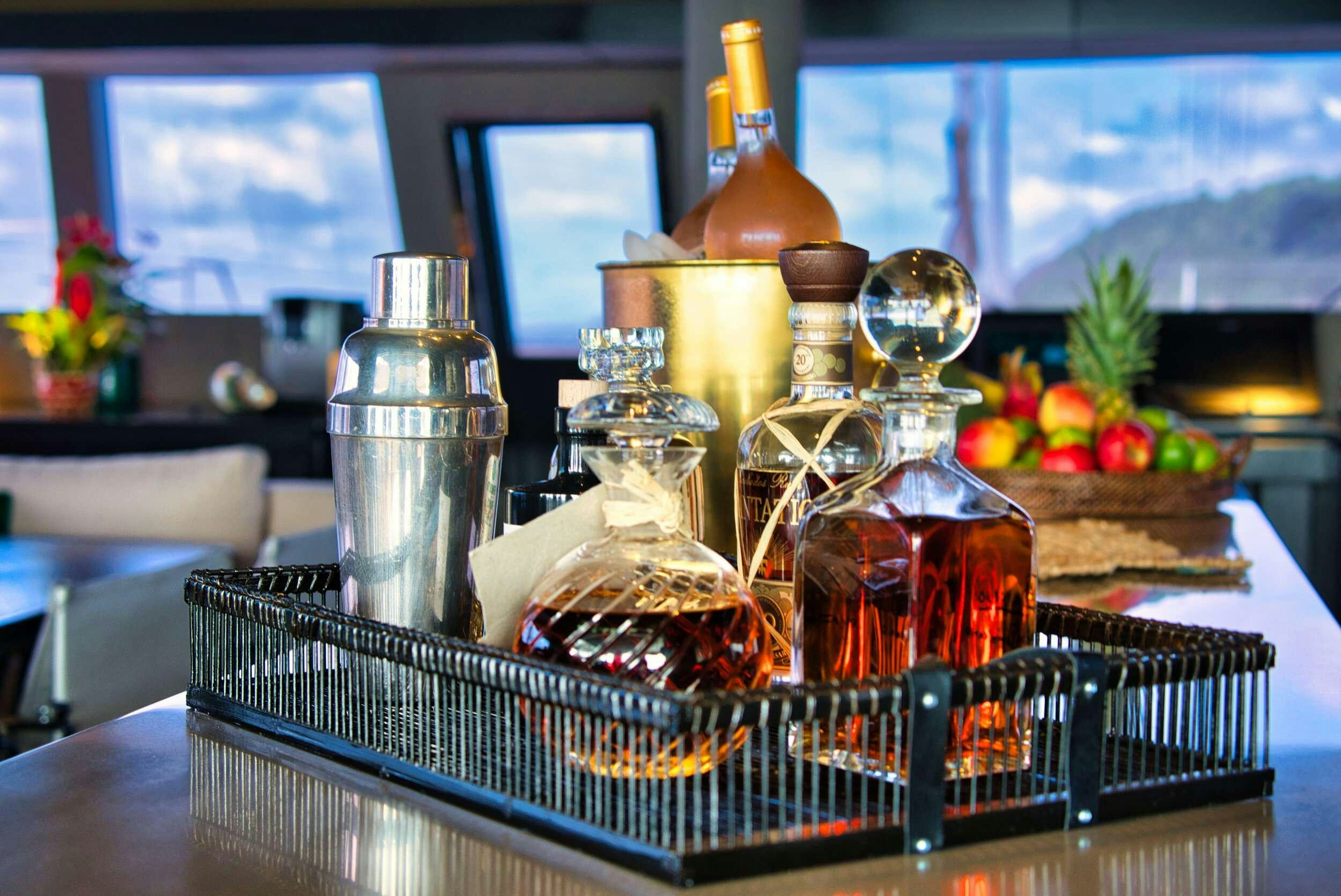 a basket of food and bottles aboard GINETTE Yacht for Charter