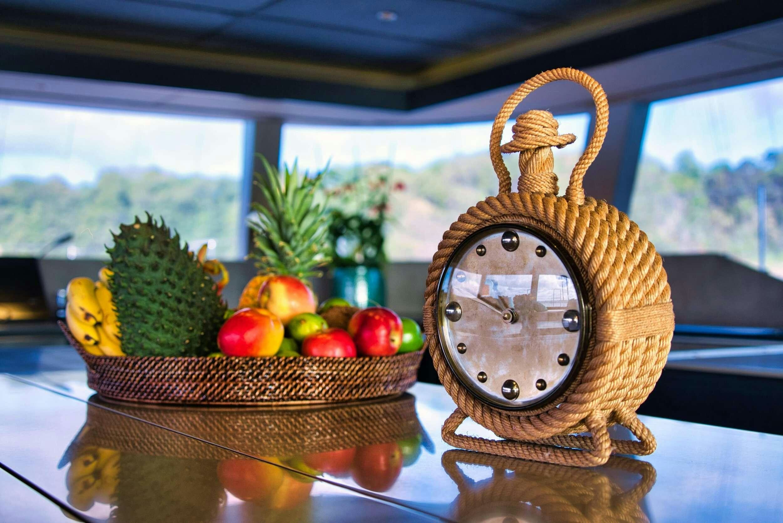 a clock on a table aboard GINETTE Yacht for Charter