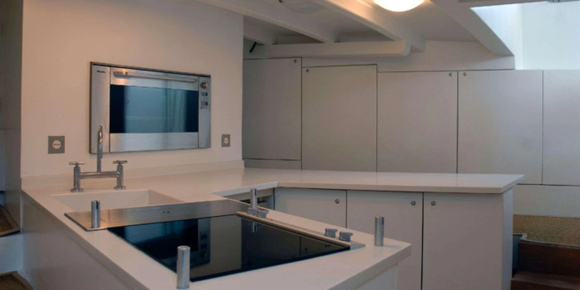 The yacht's galley features modern appliances and a sleek, minimalist design. aboard LA MER Yacht for Charter