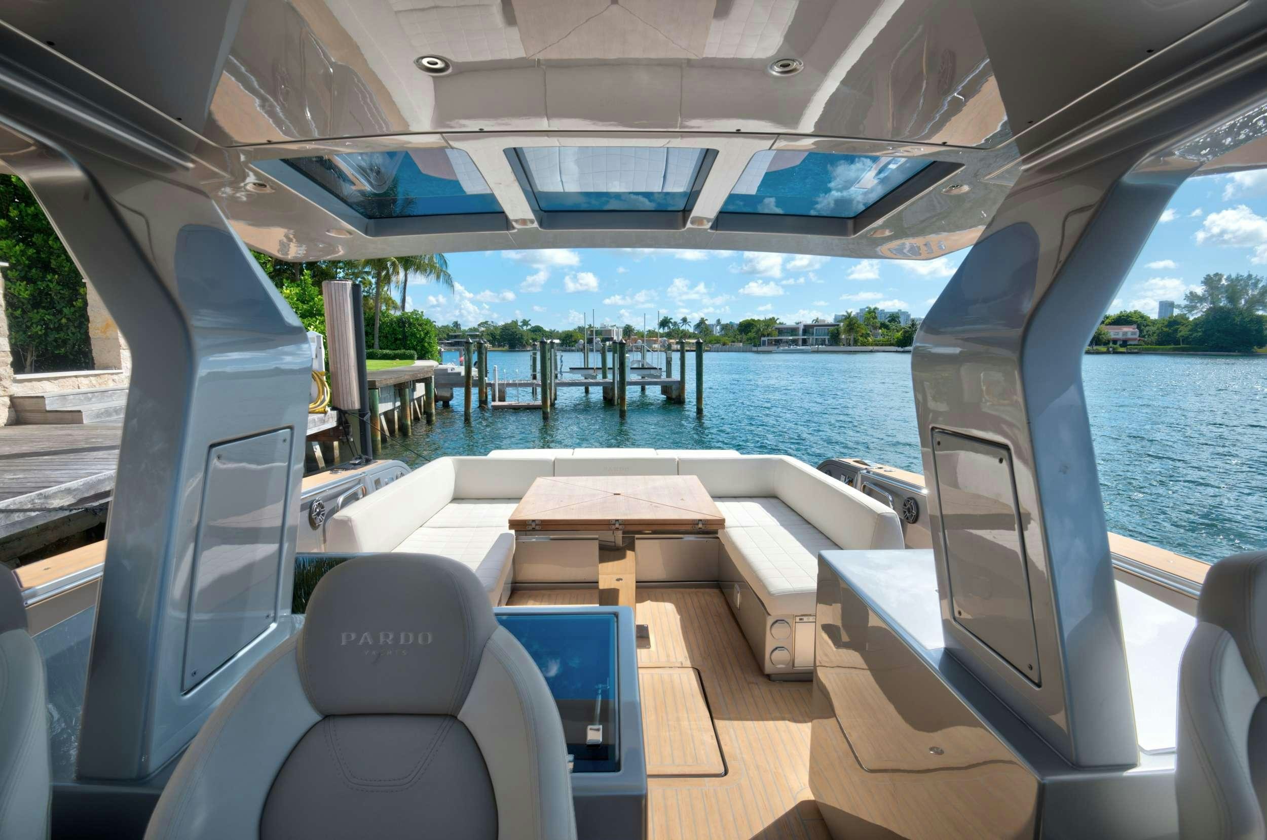 a boat with a deck and chairs aboard PARDO 50 Yacht for Charter