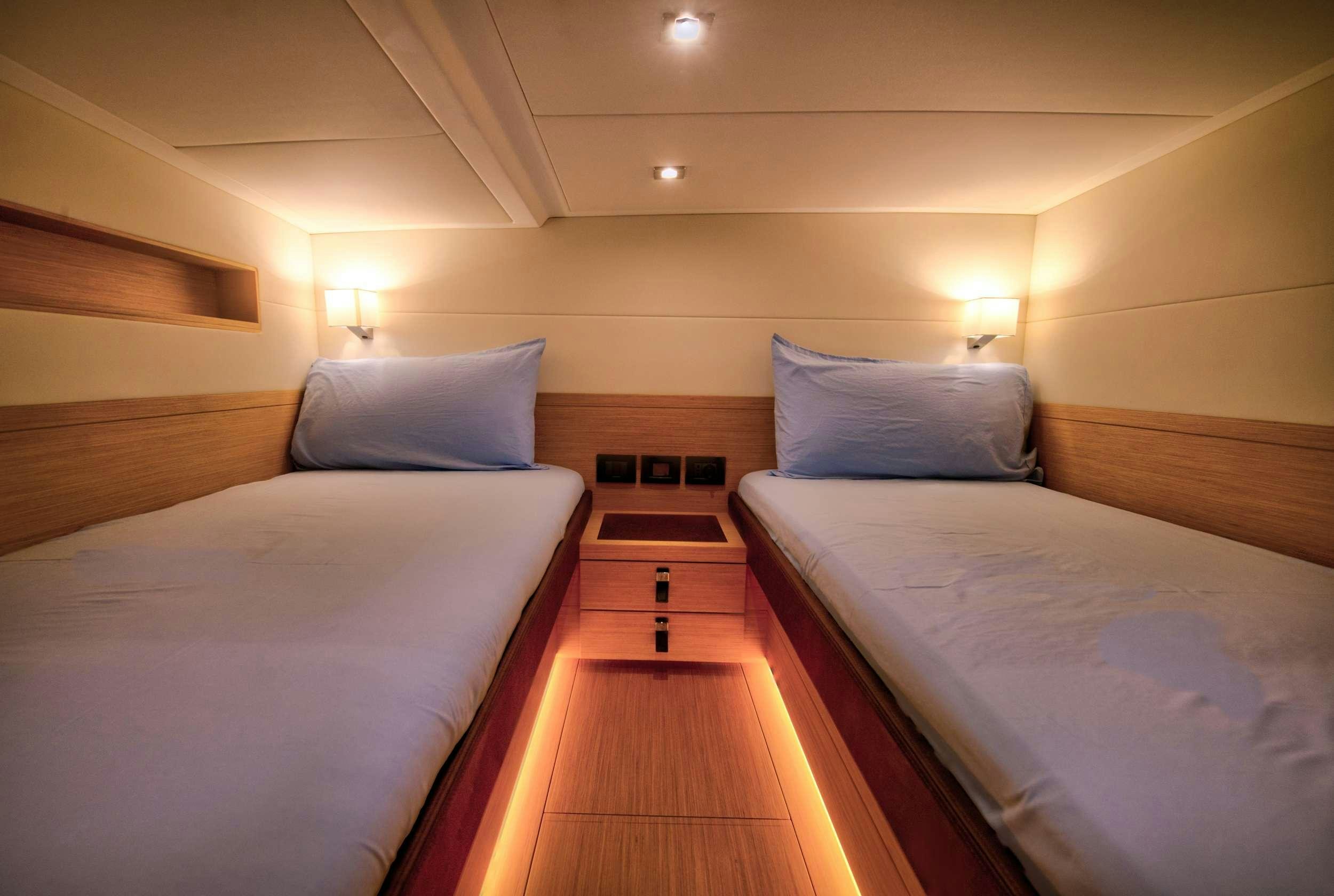 a room with two beds aboard PARDO 50 Yacht for Charter