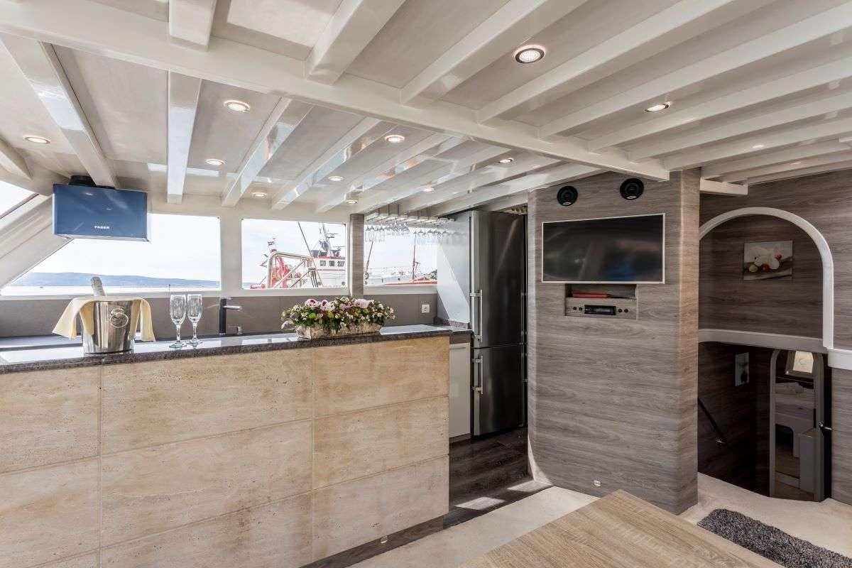 a kitchen with a large counter aboard ANDEO Yacht for Charter