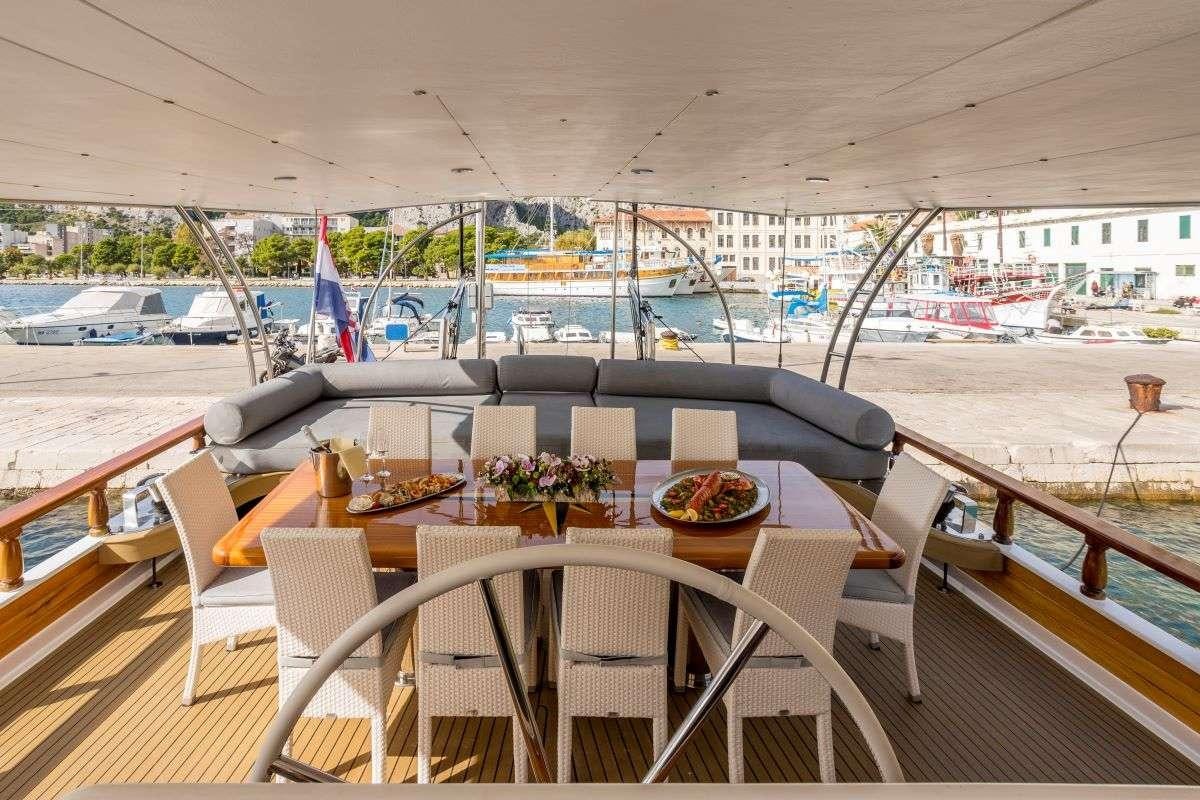 a table on a boat aboard ANDEO Yacht for Charter