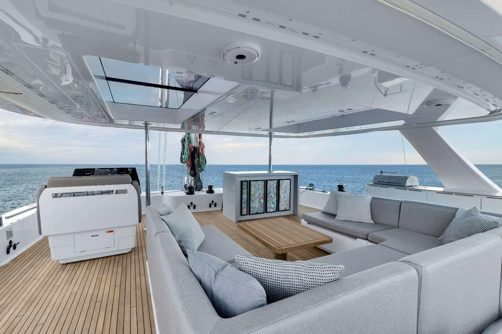 a boat with a couch and a table on it aboard AGATA BLU Yacht for Charter