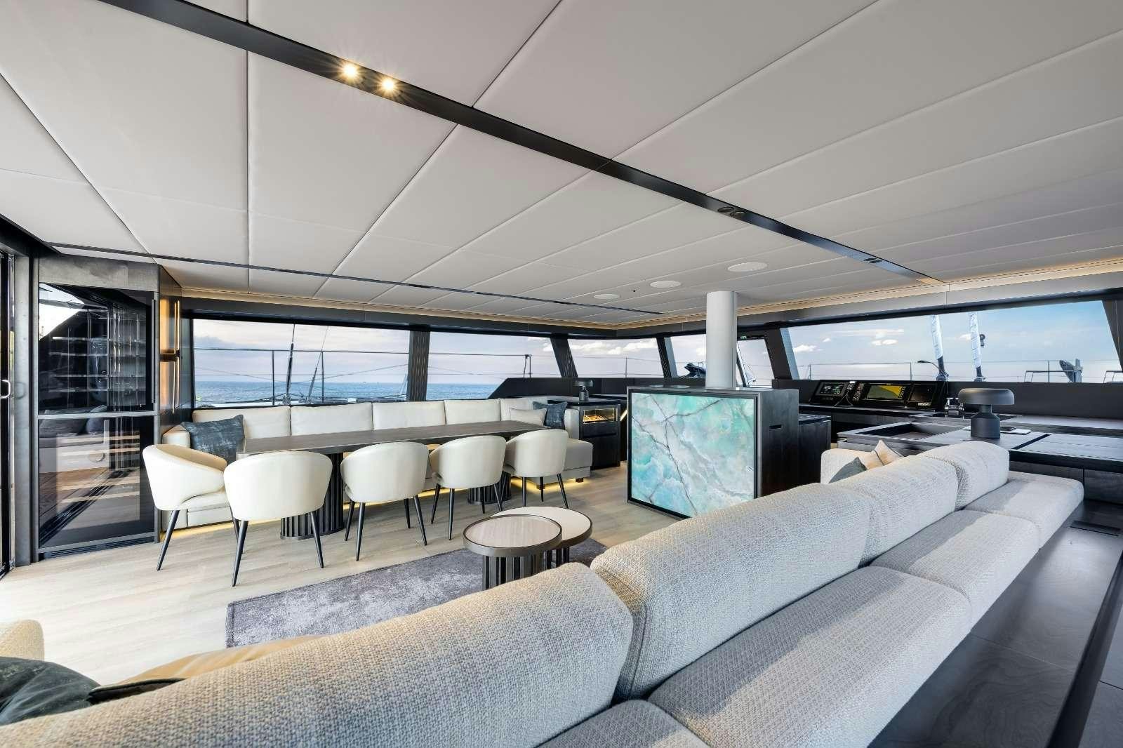 a living room with a couch and a tv aboard AGATA BLU Yacht for Charter