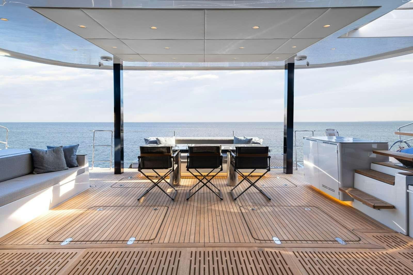 a room with a table and chairs aboard AGATA BLU Yacht for Charter