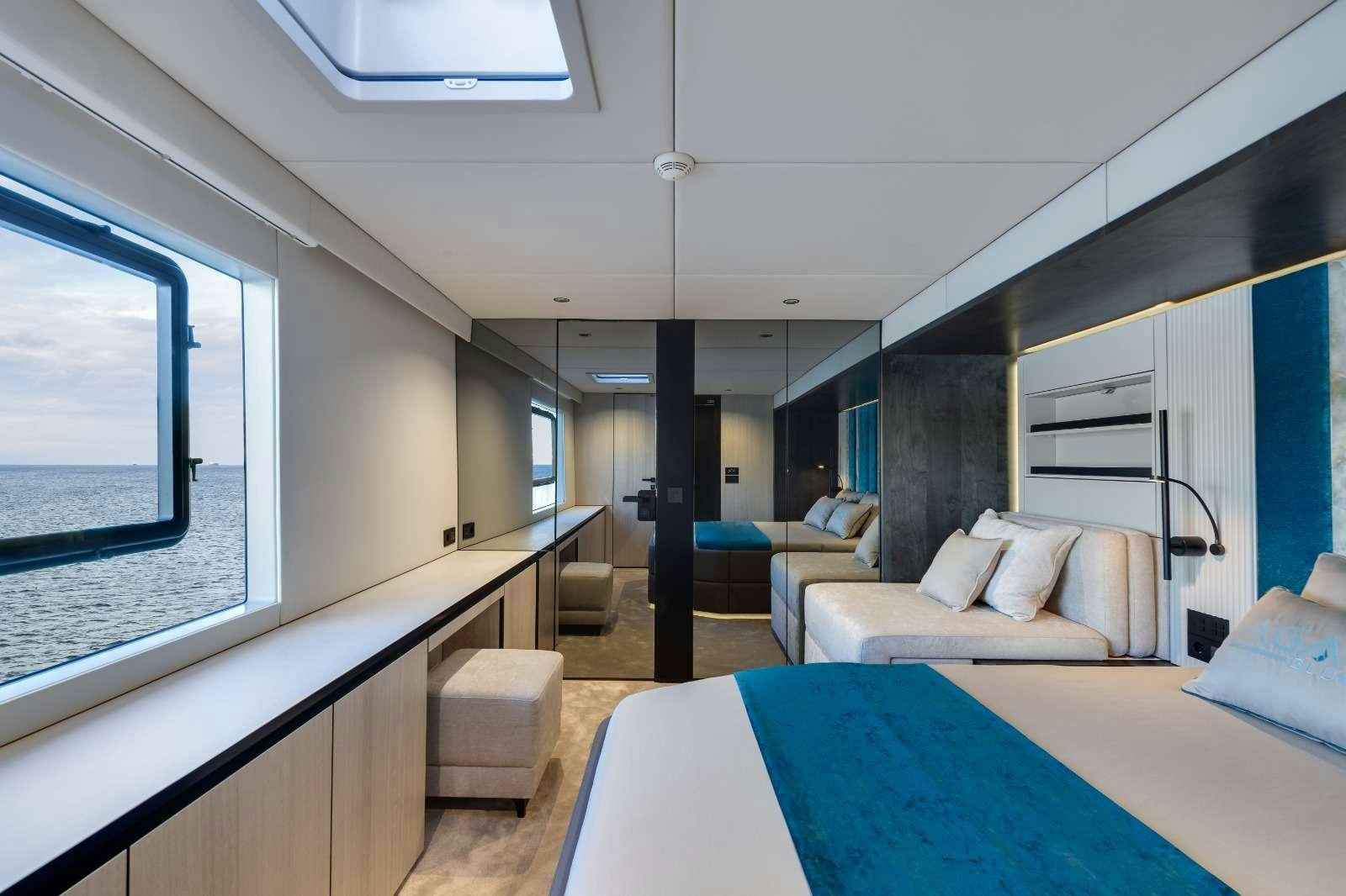 a room with a table and couches aboard AGATA BLU Yacht for Charter