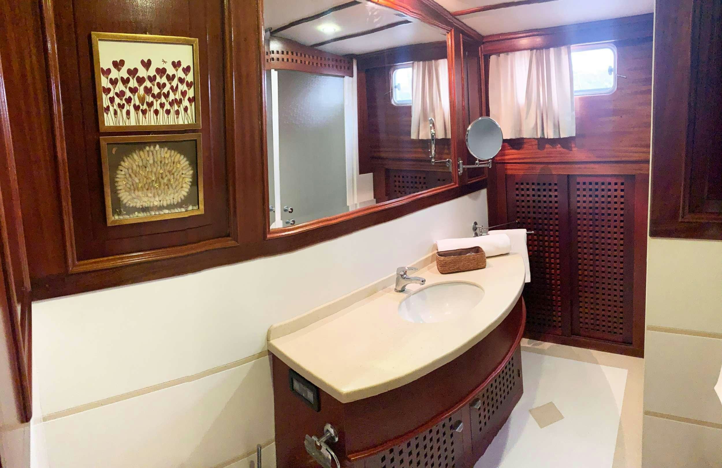 a bathroom with a sink and cabinets aboard ELIANORA Yacht for Charter