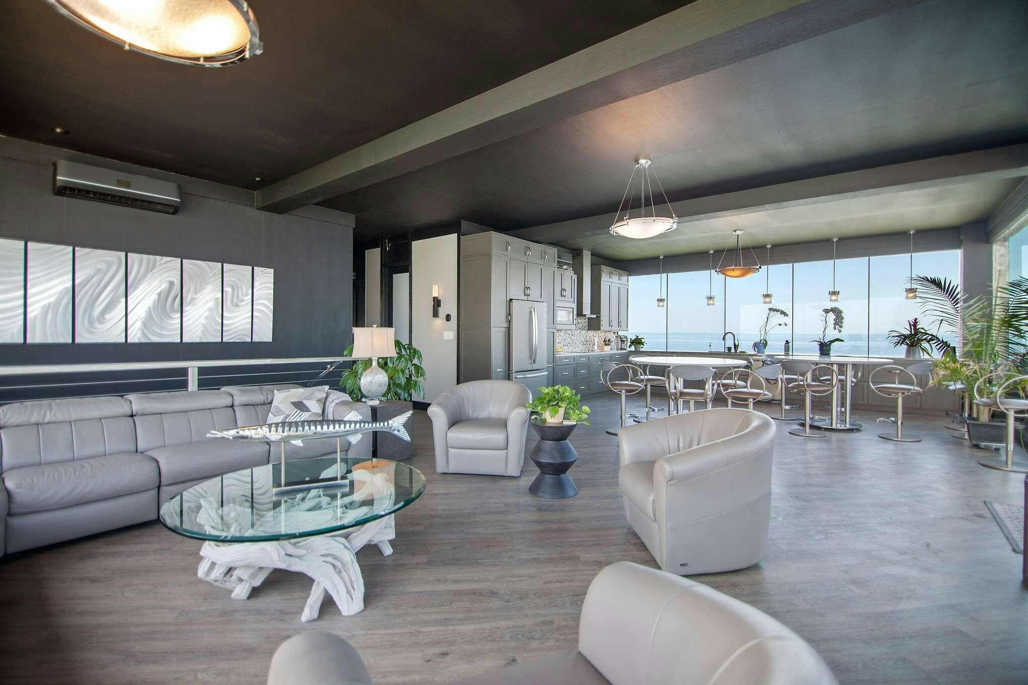 a living room with a large open floor plan aboard MANSION YACHT Yacht for Charter