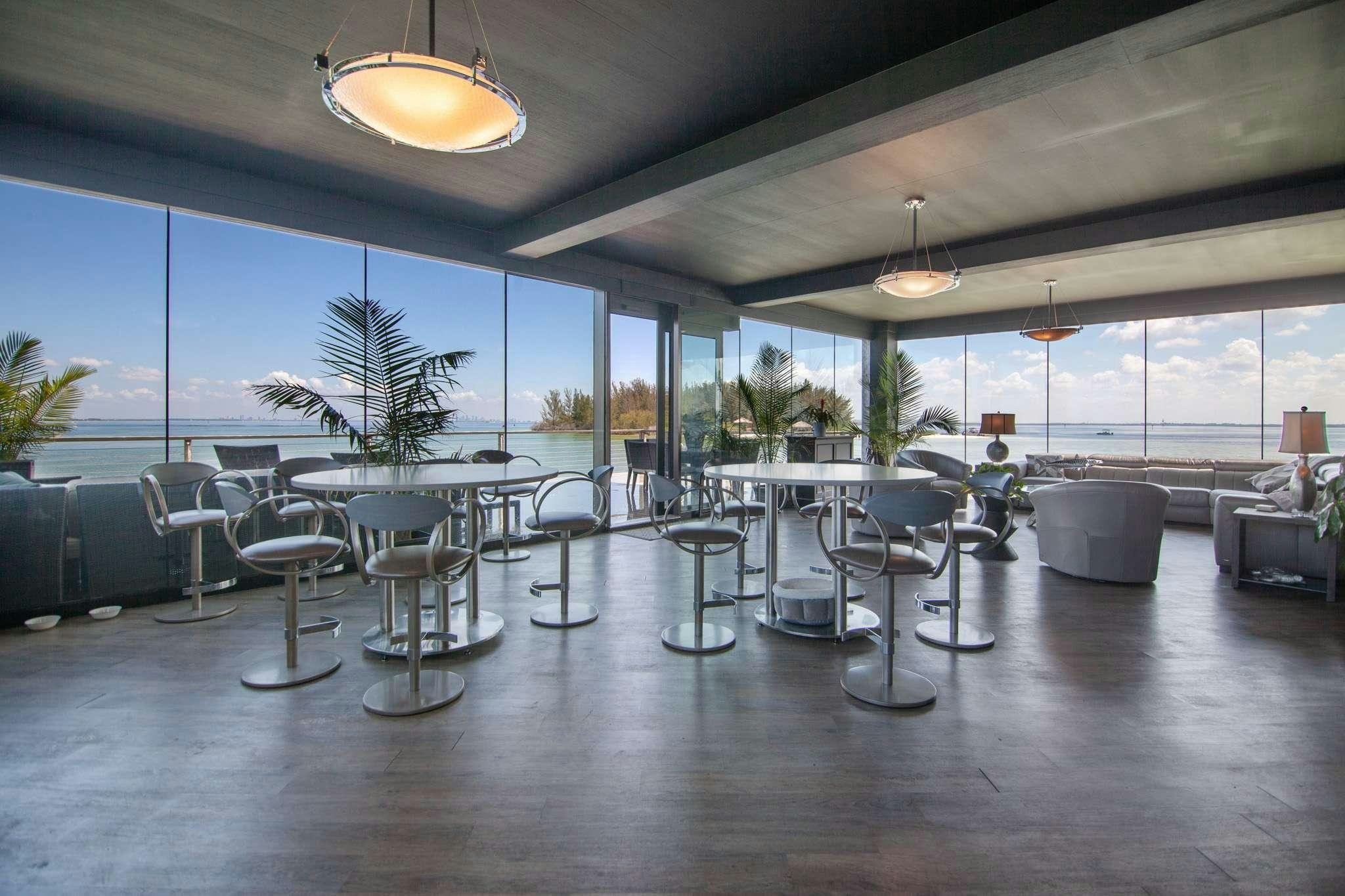 a room with tables and chairs aboard MANSION YACHT Yacht for Charter