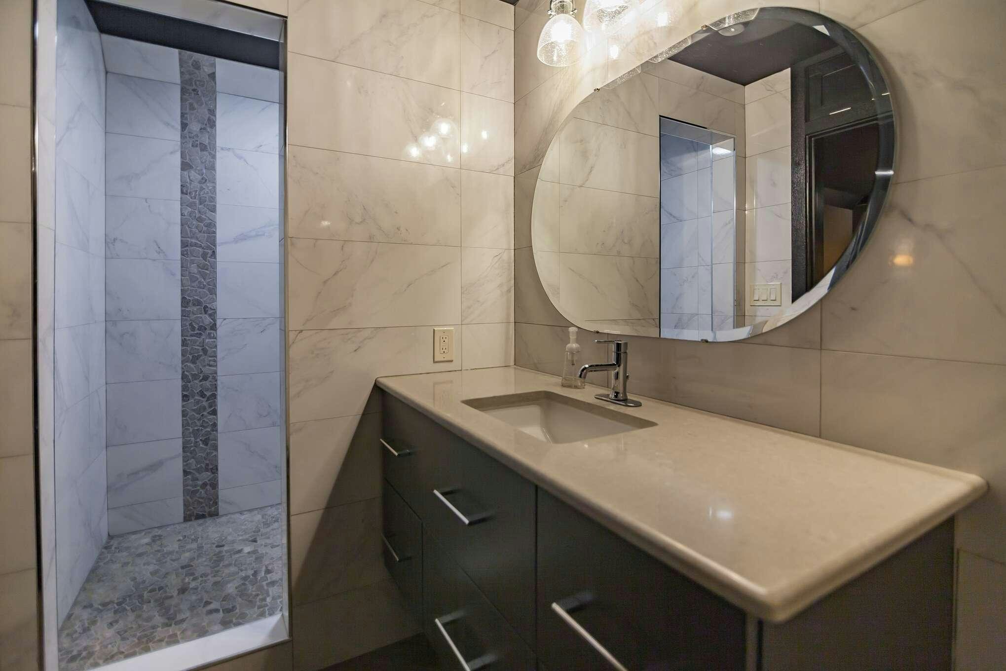 a bathroom with a large mirror aboard MANSION YACHT Yacht for Charter