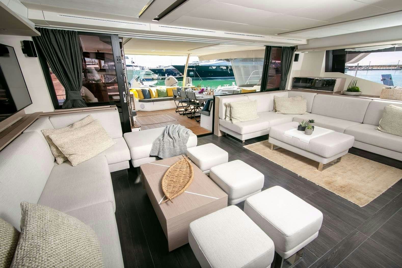 a living room with a large window aboard ALENA Yacht for Charter