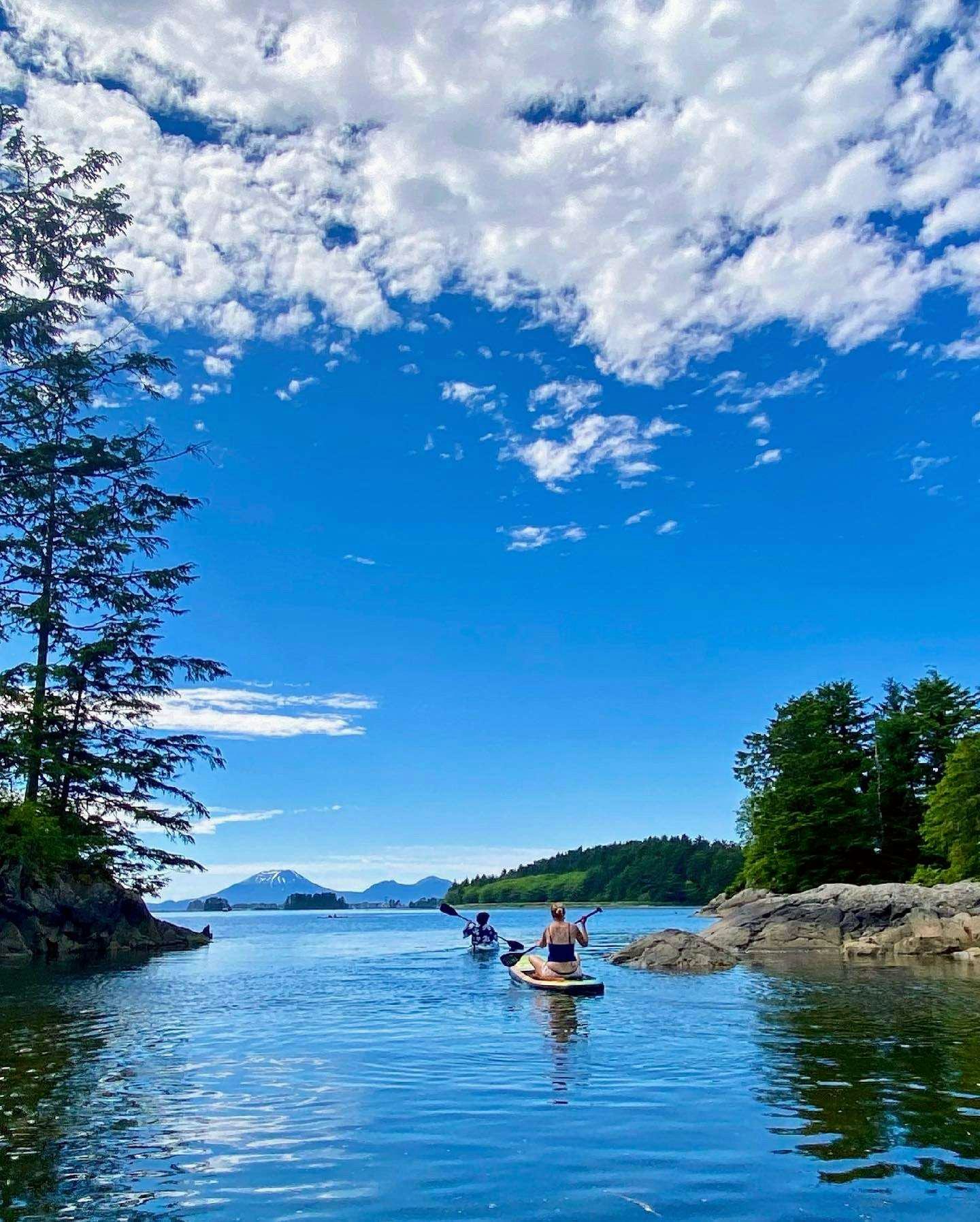 people rowing a boat on a lake aboard BEAR PAW Yacht for Charter