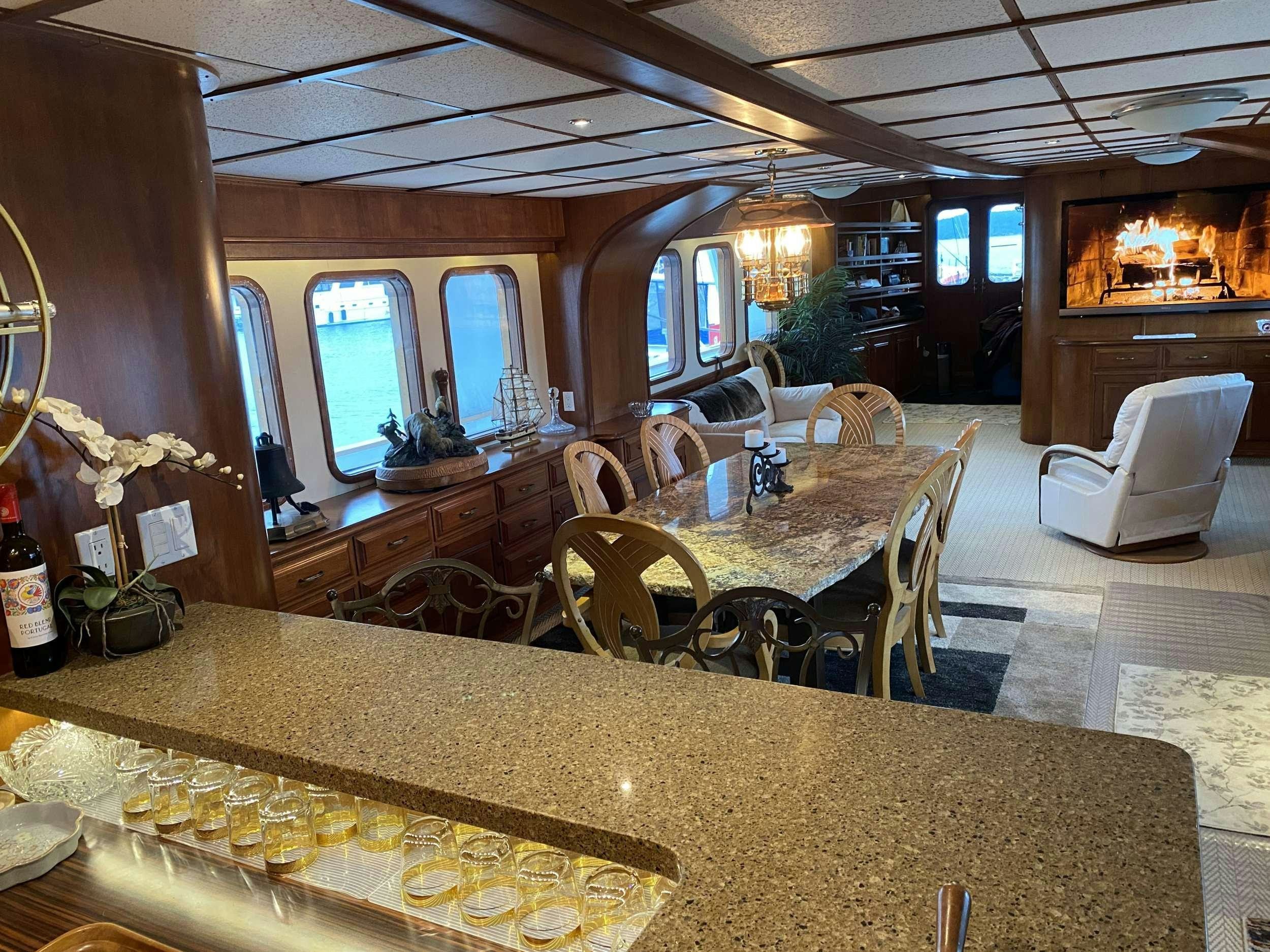 a dining room with a table aboard BEAR PAW Yacht for Charter
