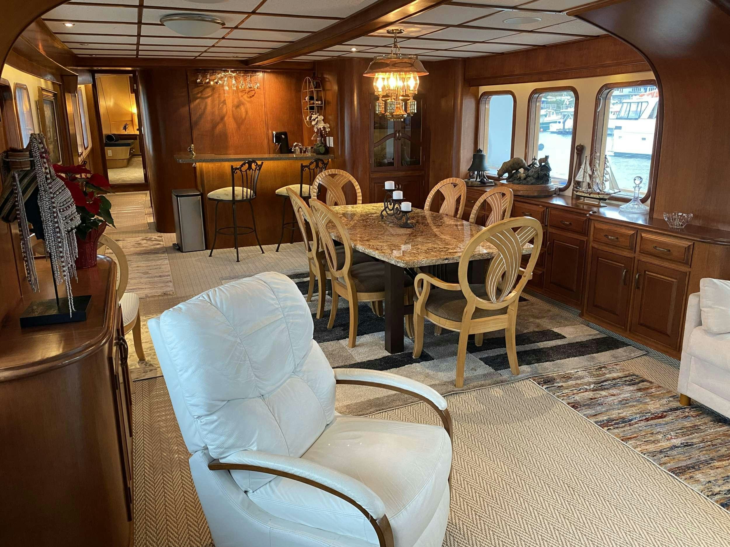 a dining room with chairs and tables aboard BEAR PAW Yacht for Charter