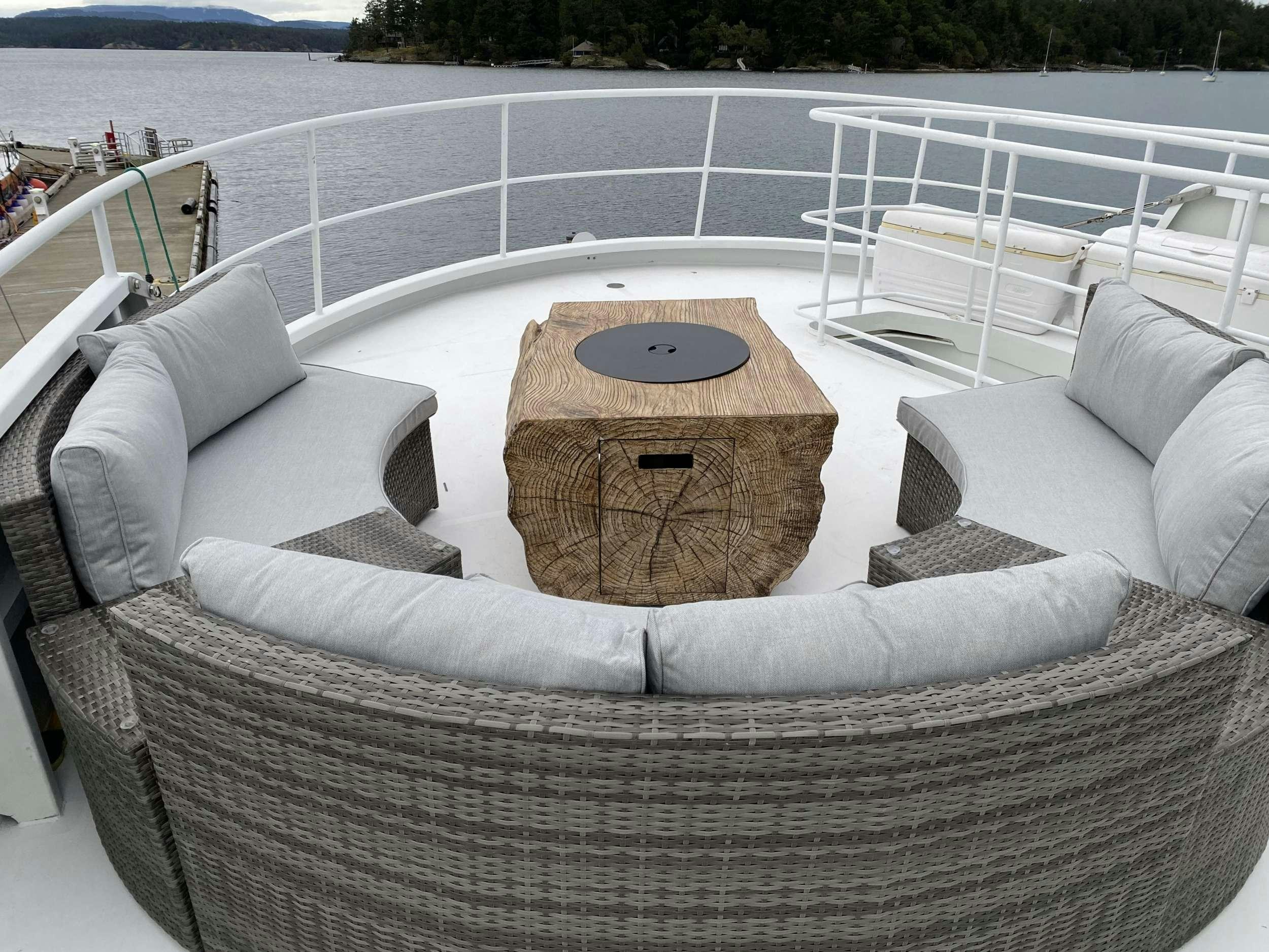 a couch with a clock on it aboard BEAR PAW Yacht for Charter