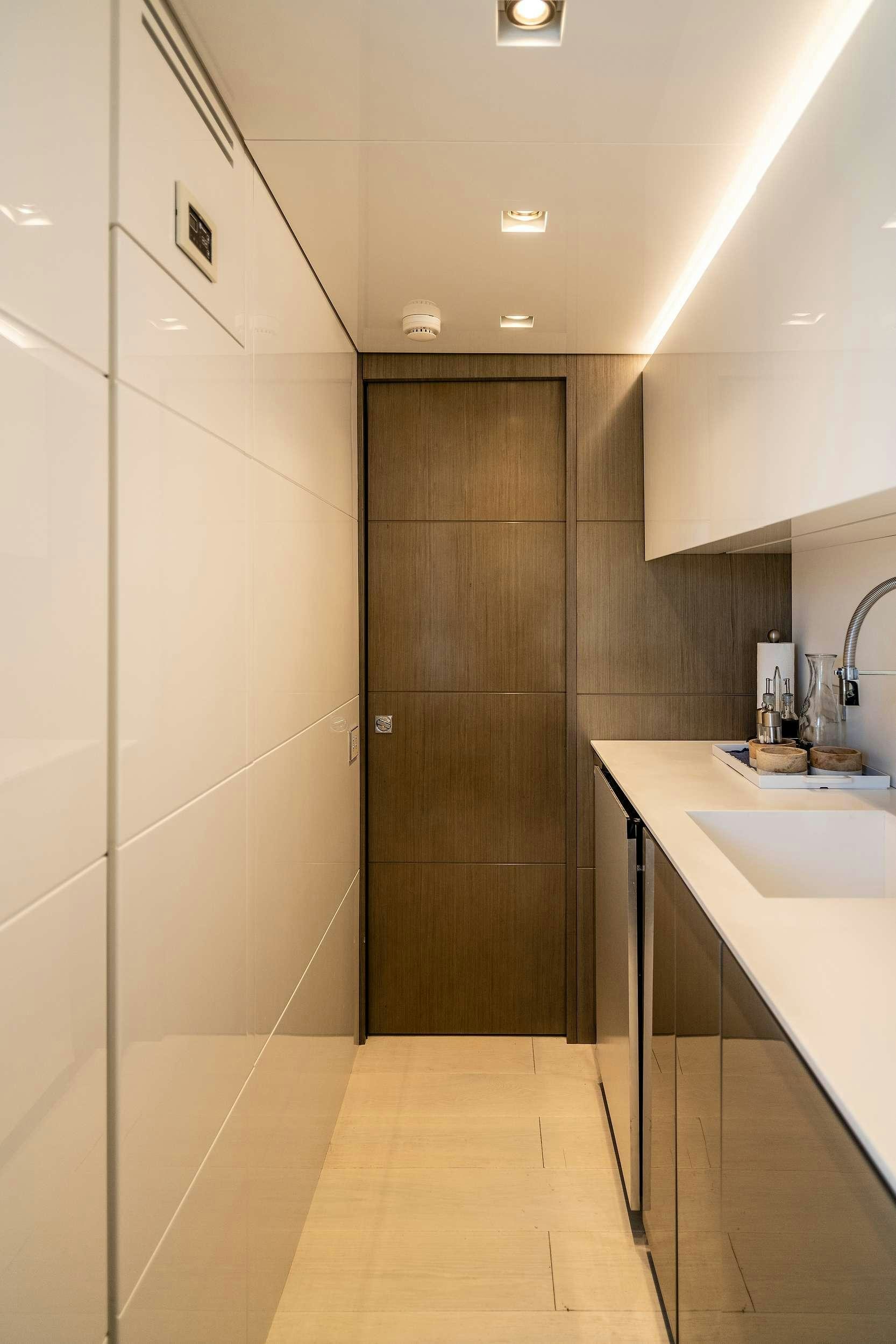 a bathroom with a sink and a shower unit aboard THE PEDDLER Yacht for Charter