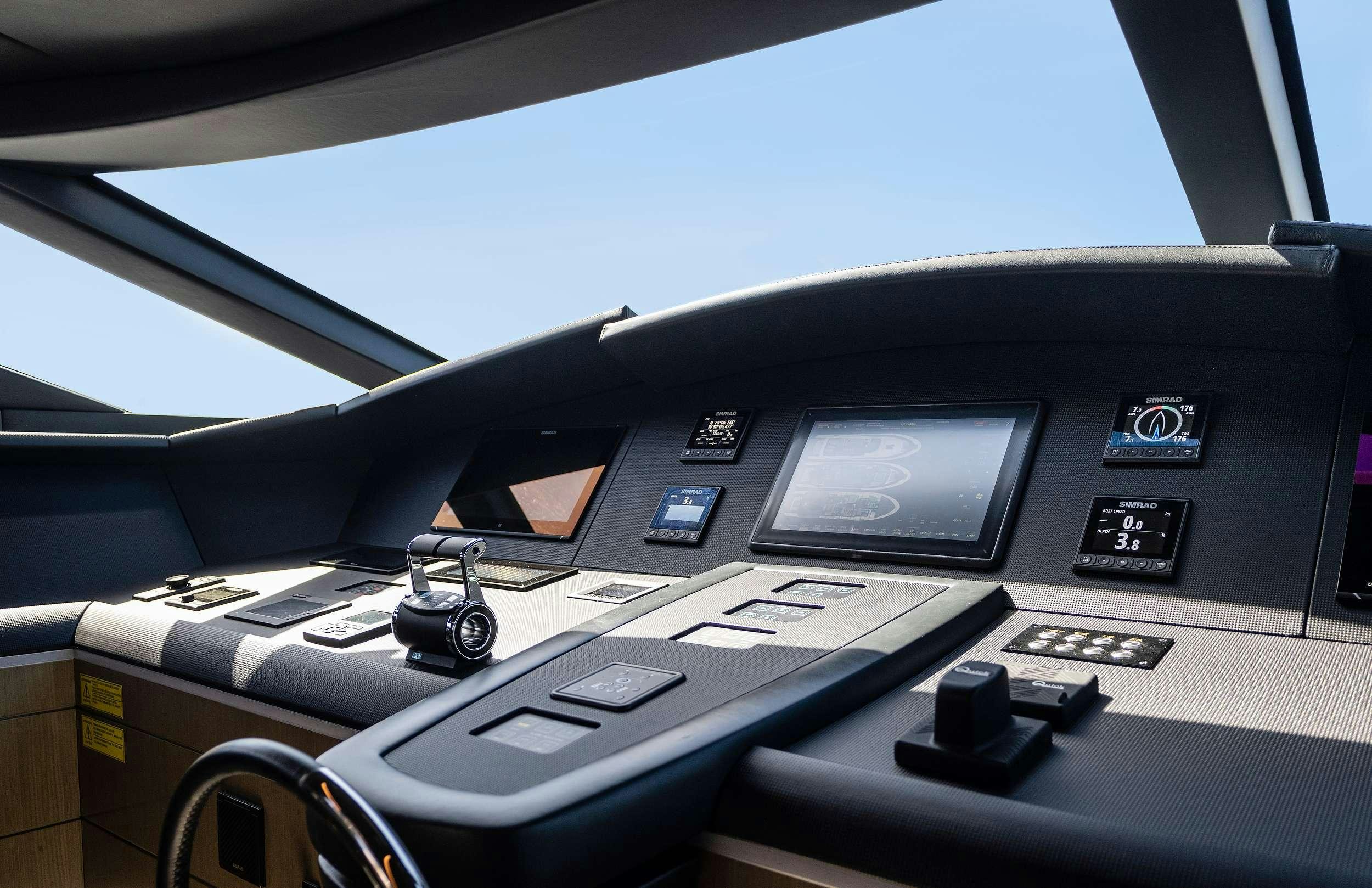 a black console with a white console and buttons on it aboard THE PEDDLER Yacht for Charter