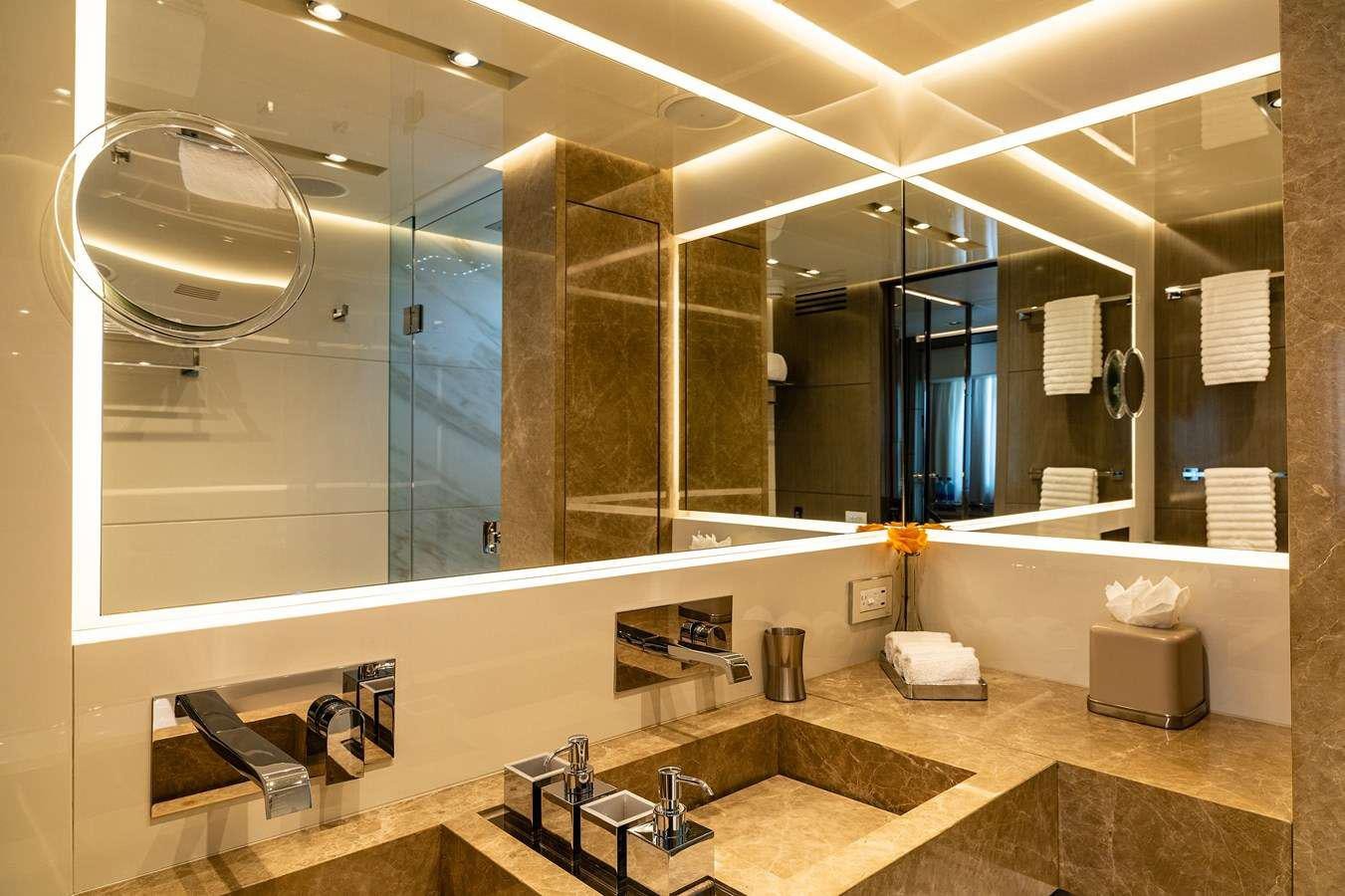 a large bathroom with a large mirror aboard THE PEDDLER Yacht for Charter