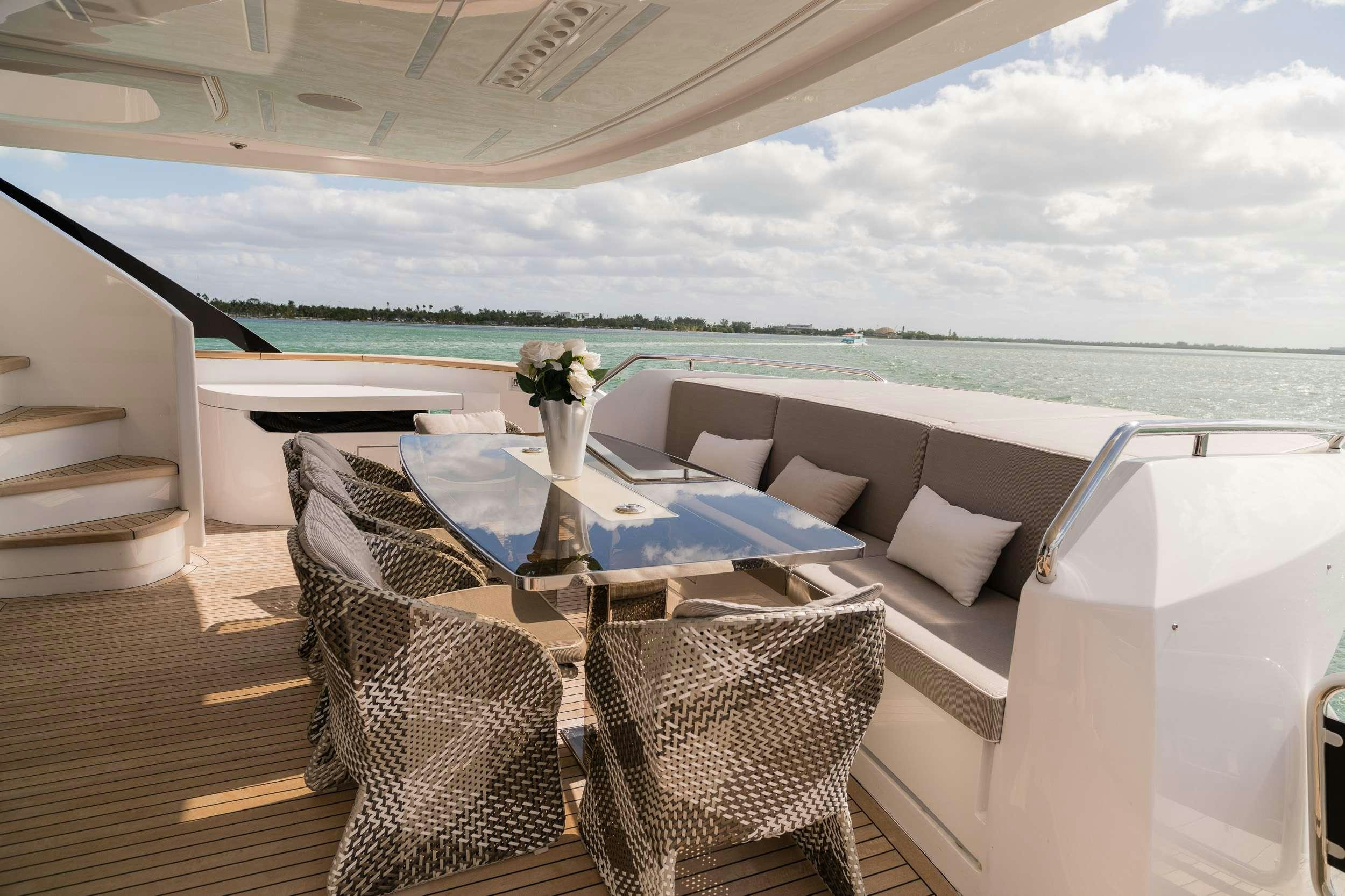 a room with a table and chairs aboard THE PEDDLER Yacht for Sale