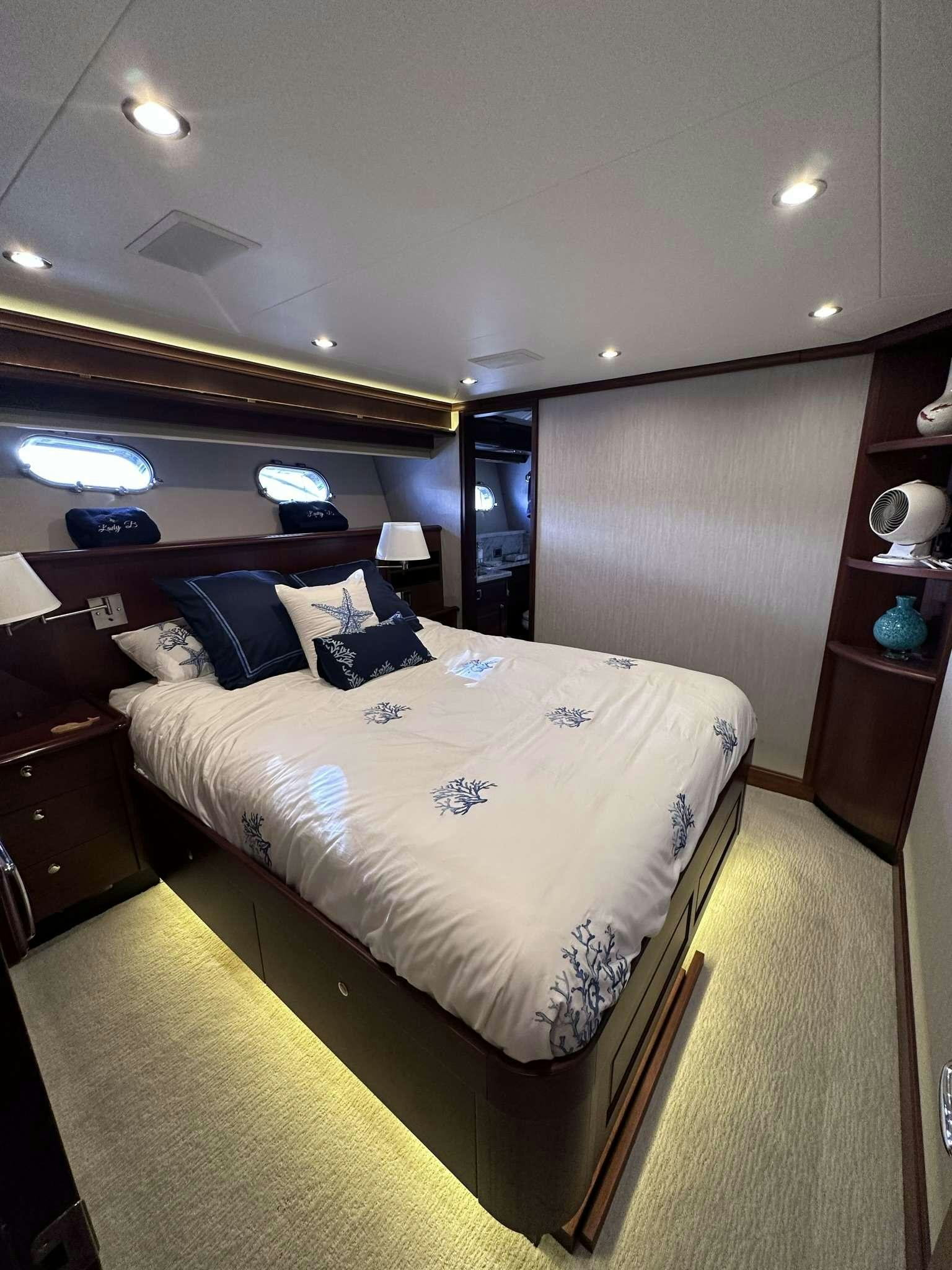 a bed in a room aboard LADY B Yacht for Charter