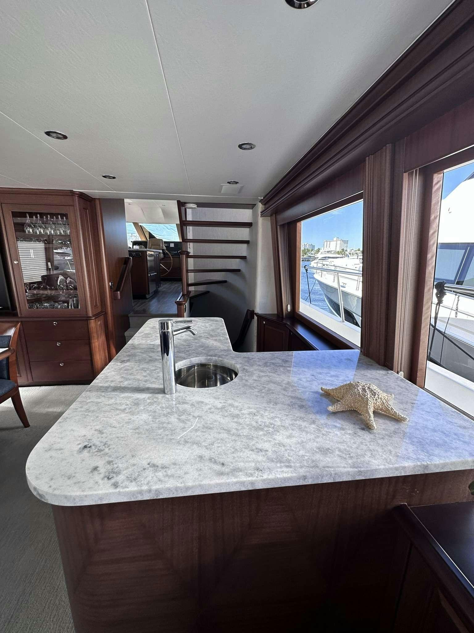 a large kitchen table aboard LADY B Yacht for Charter