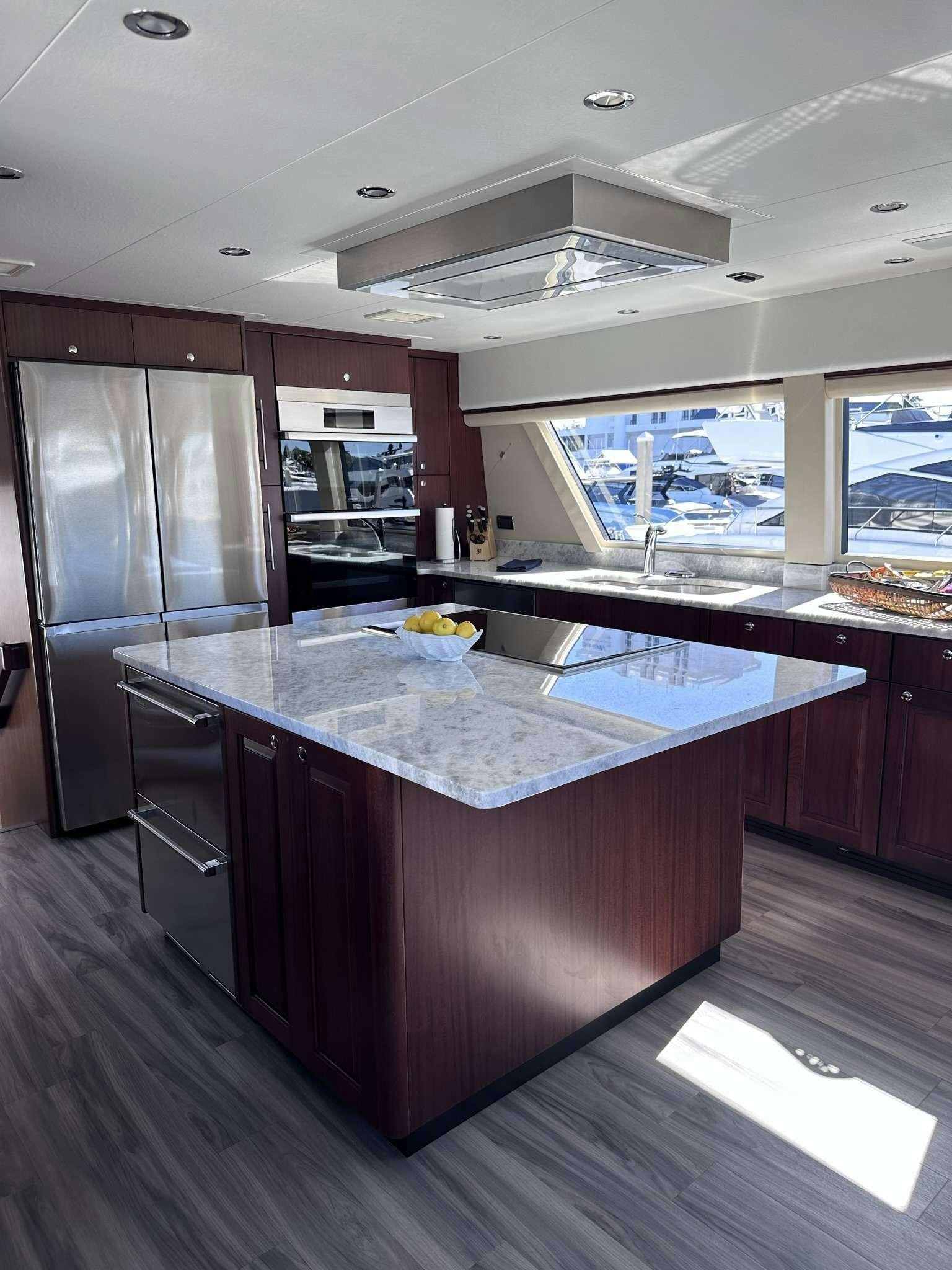 a kitchen with a large island aboard LADY B Yacht for Charter