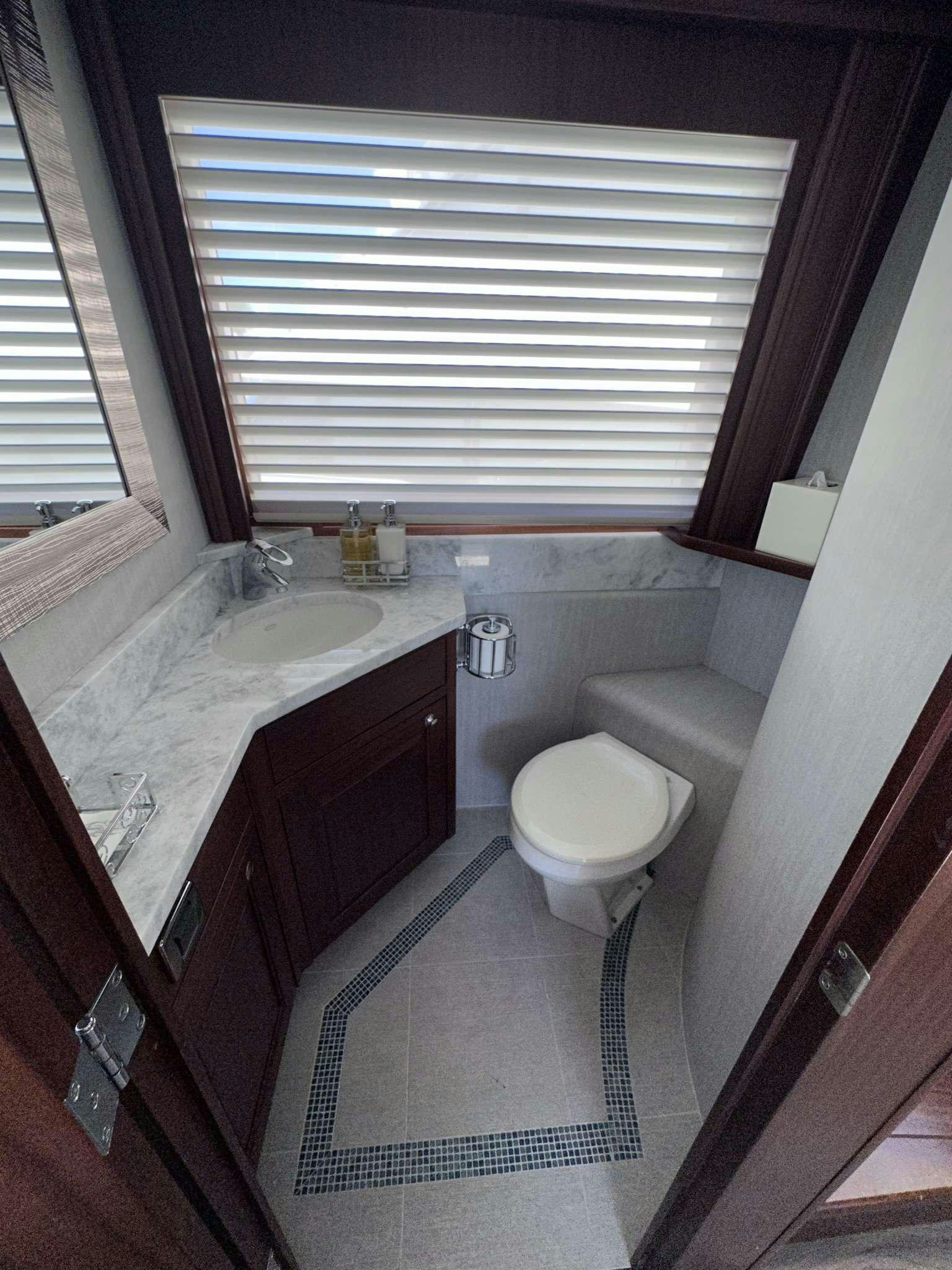 a bathroom with a sink toilet and a bathtub aboard LADY B Yacht for Charter