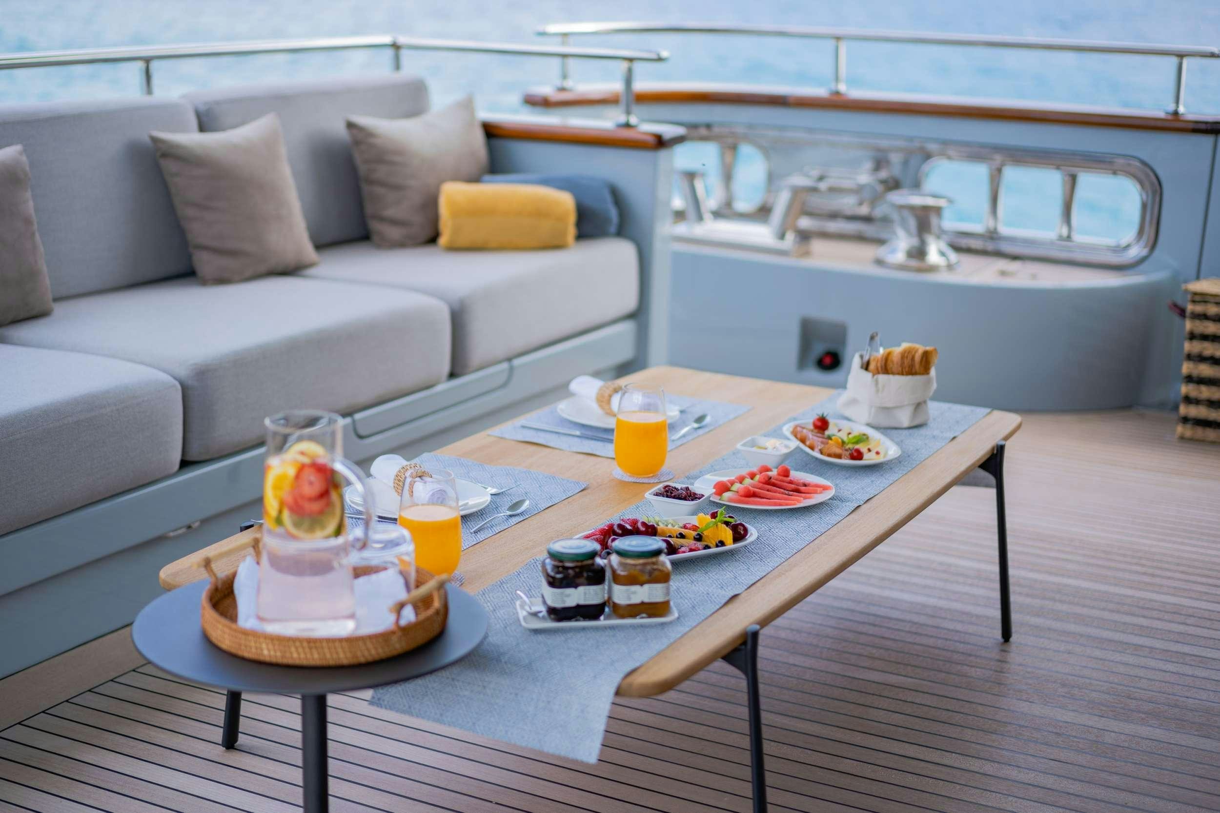 a table with food on it aboard VALENTINA II Yacht for Charter