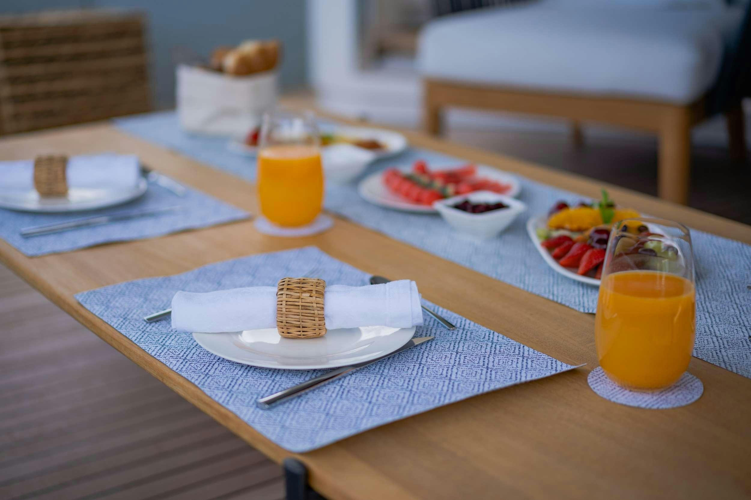 a table with food and drinks on it aboard VALENTINA II Yacht for Charter
