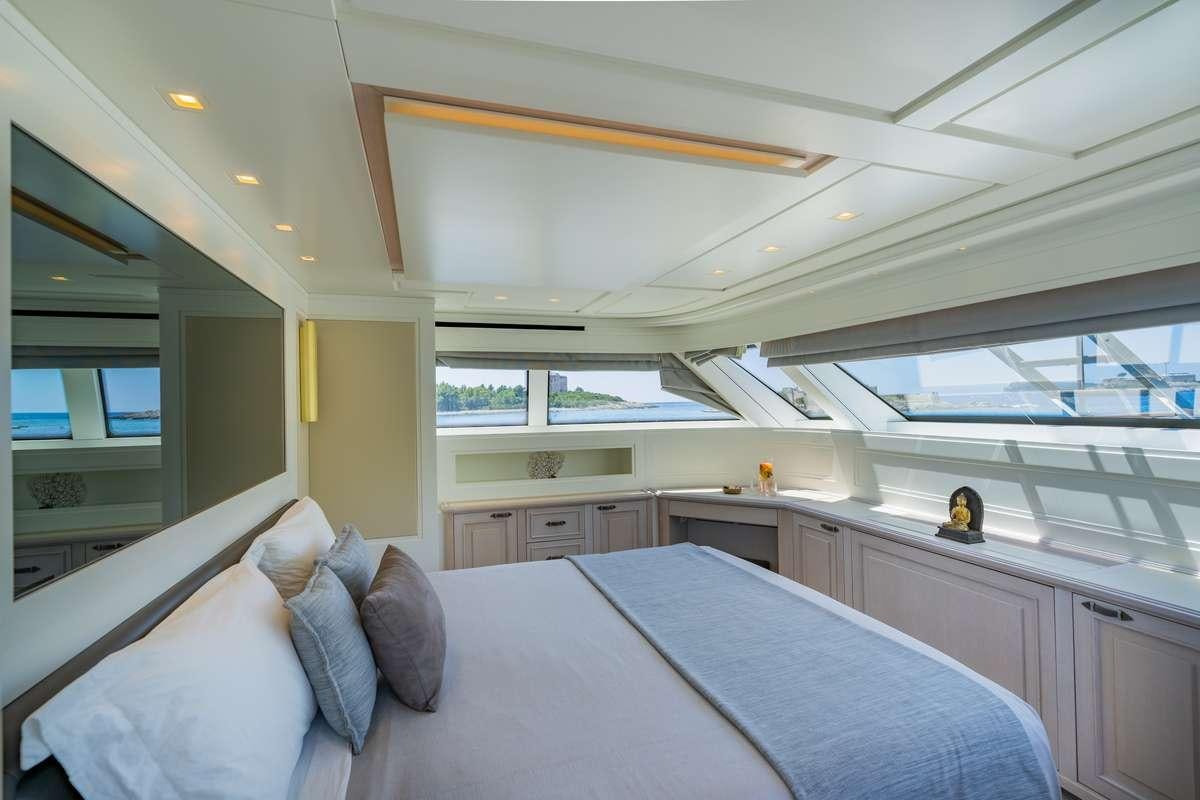 a large bedroom with a large bed aboard VALENTINA II Yacht for Charter