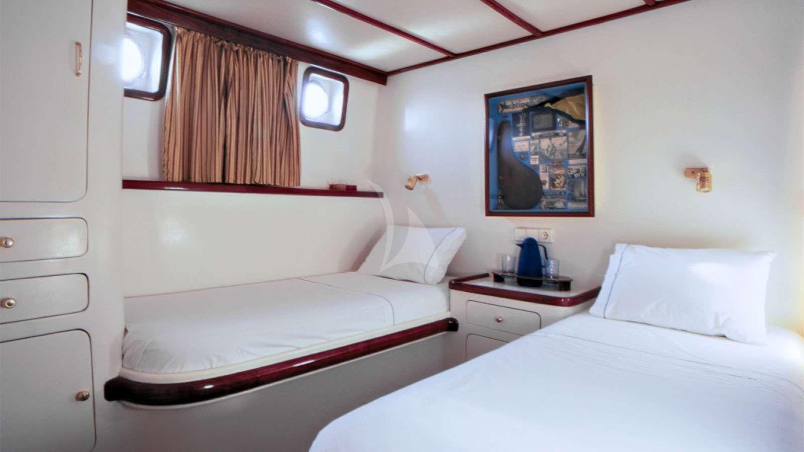 a room with two beds aboard ALMYRA Yacht for Charter