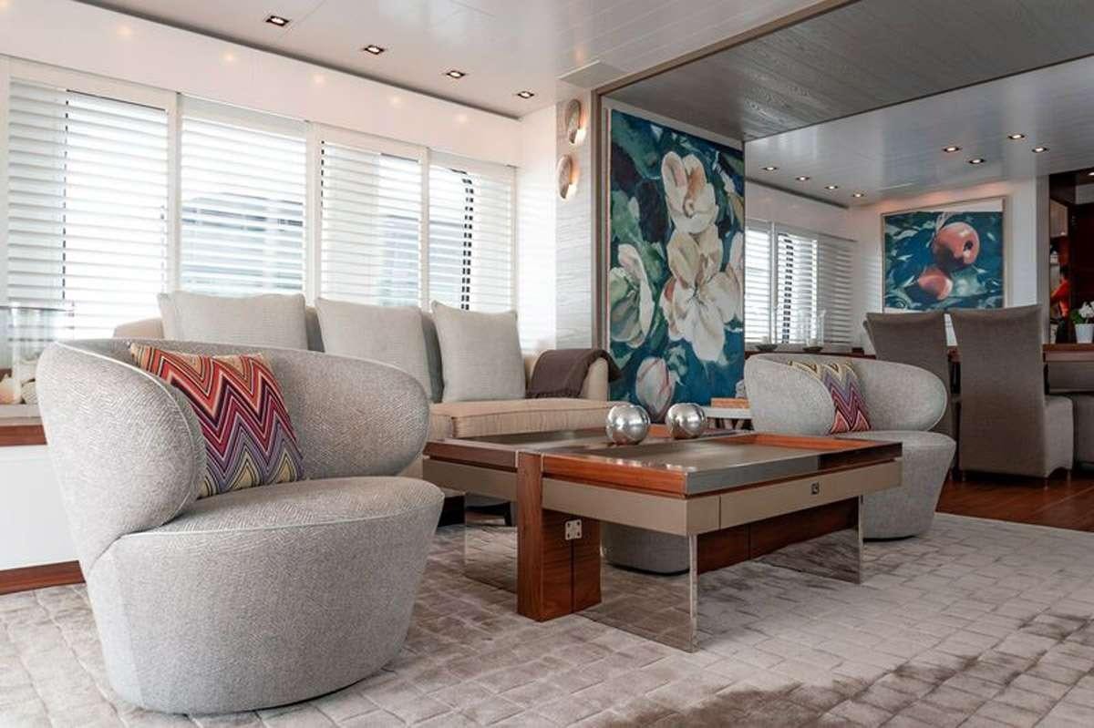 a living room with a couch and a coffee table aboard HEERLIJCKHEID Yacht for Charter