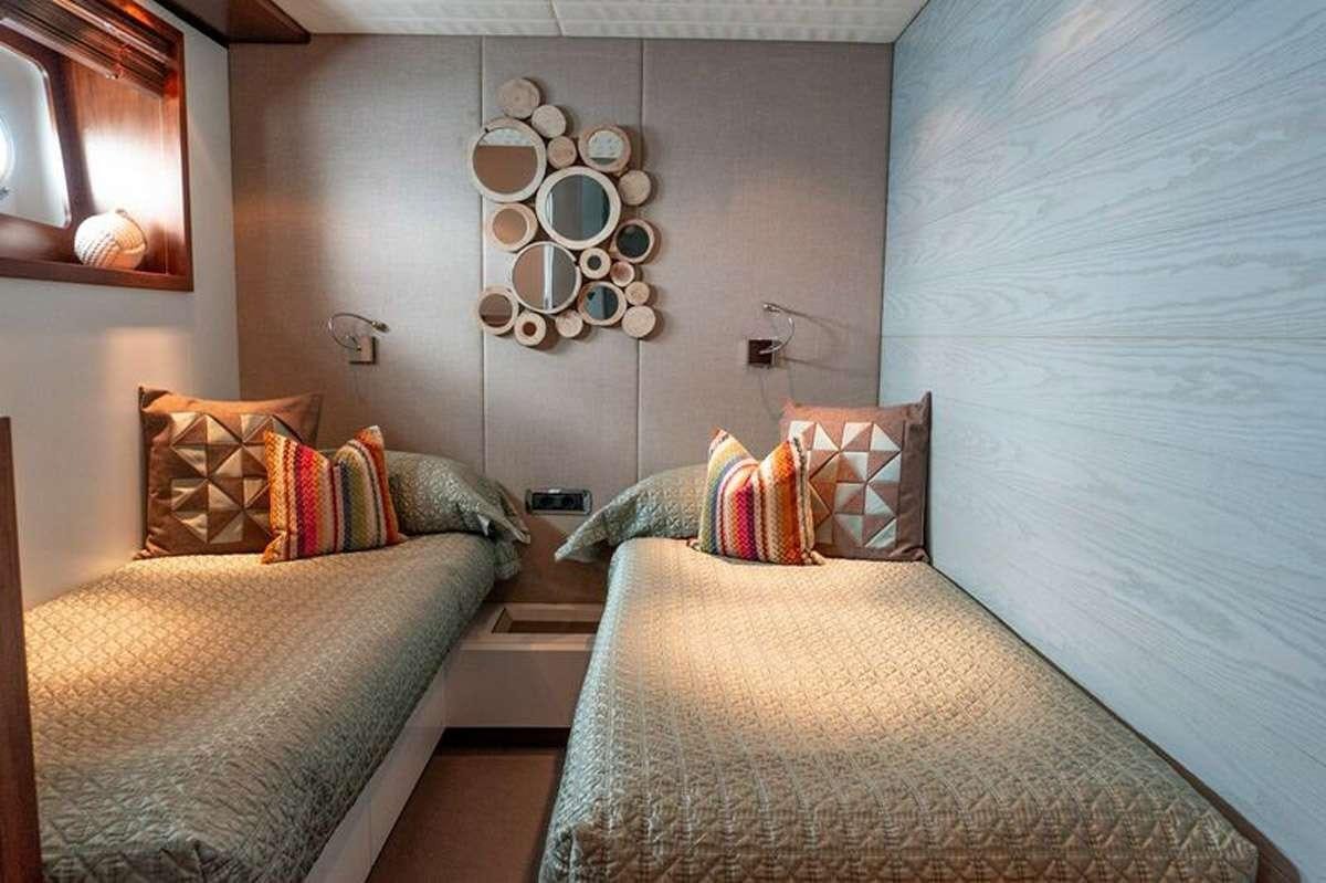 a couple of beds in a room aboard HEERLIJCKHEID Yacht for Charter
