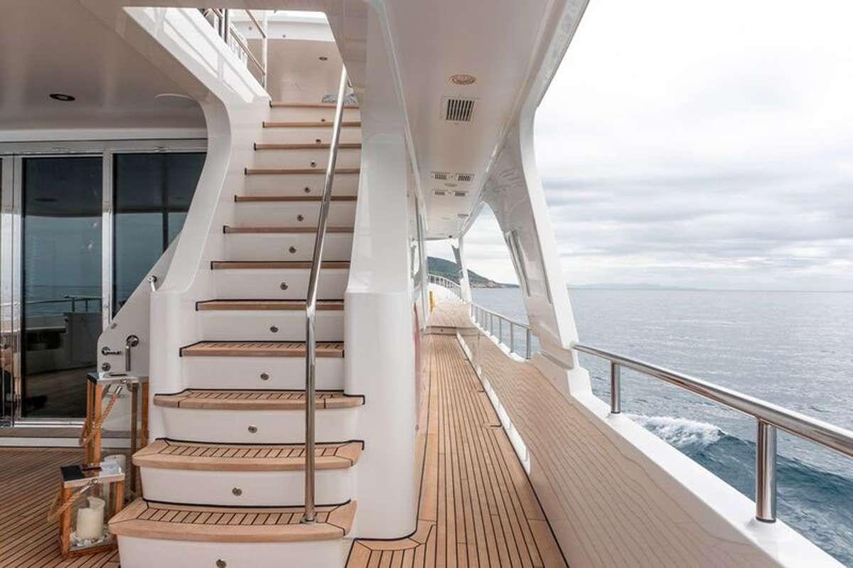 a wooden staircase on a boat aboard HEERLIJCKHEID Yacht for Charter
