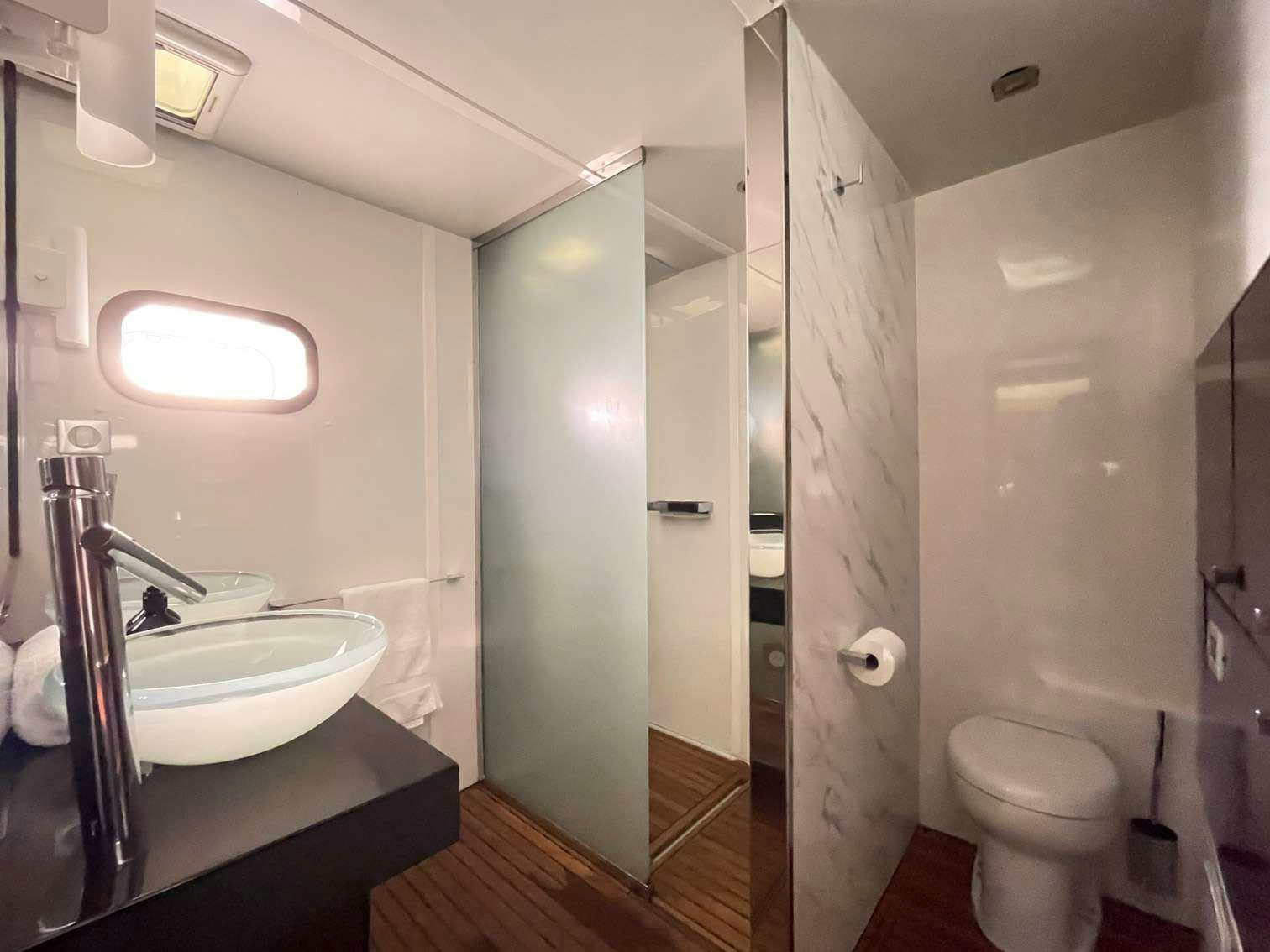 a bathroom with a sink and a toilet aboard SEAZEN II Yacht for Charter