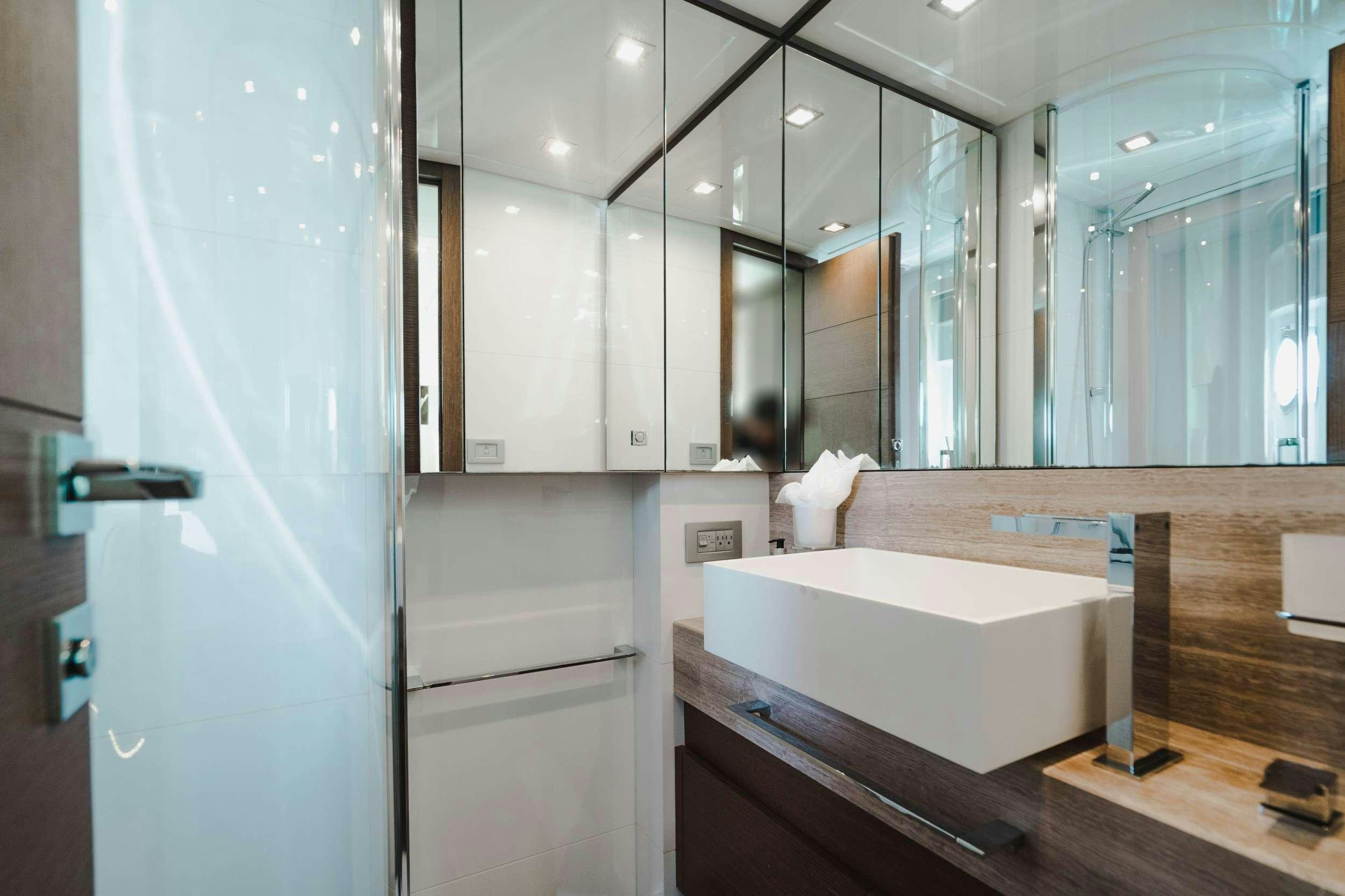 a bathroom with a large mirror aboard MIRABILIS Yacht for Charter