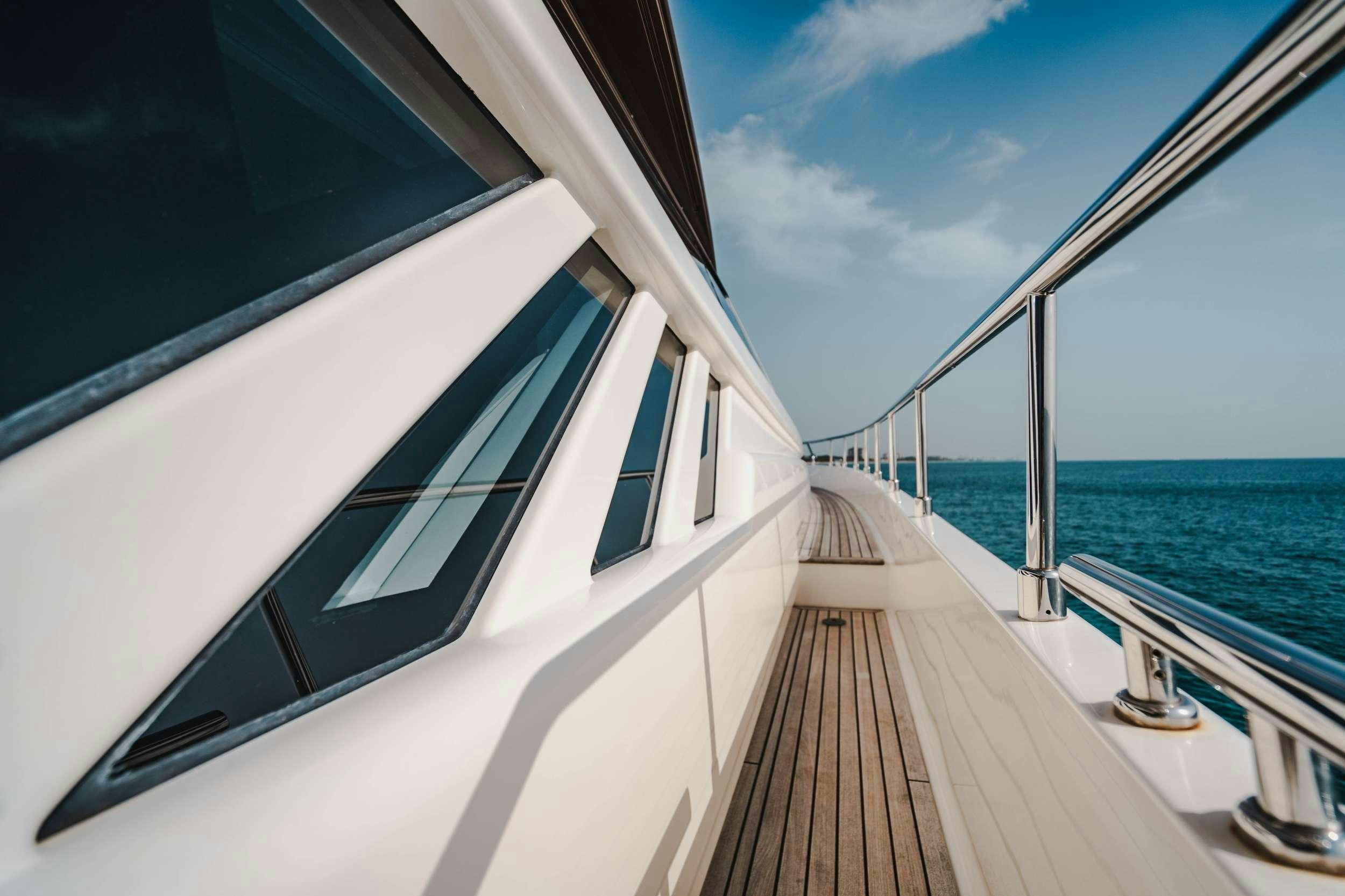 a white train on a track aboard MIRABILIS Yacht for Charter