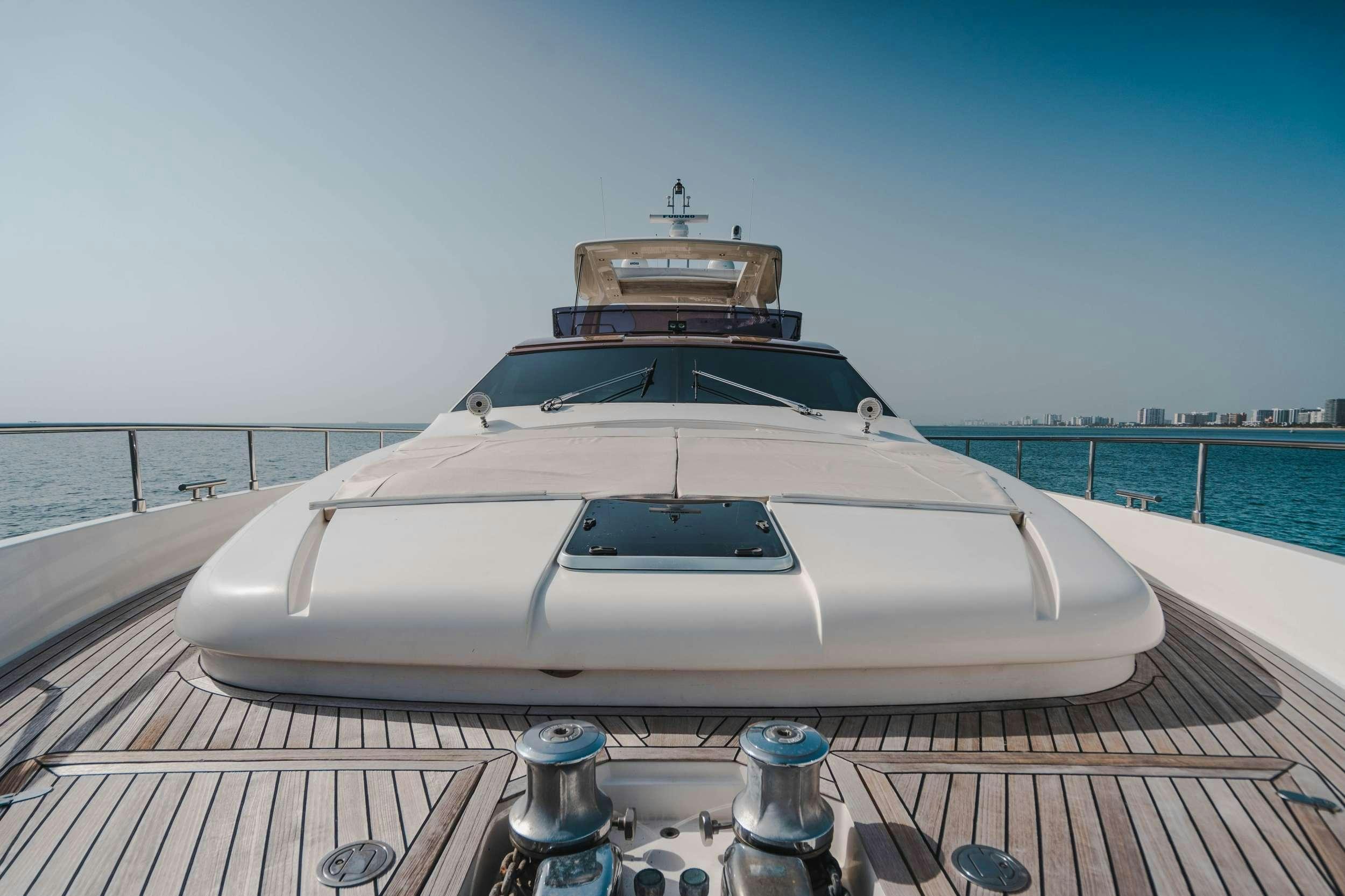 a white car on a wooden deck aboard MIRABILIS Yacht for Charter