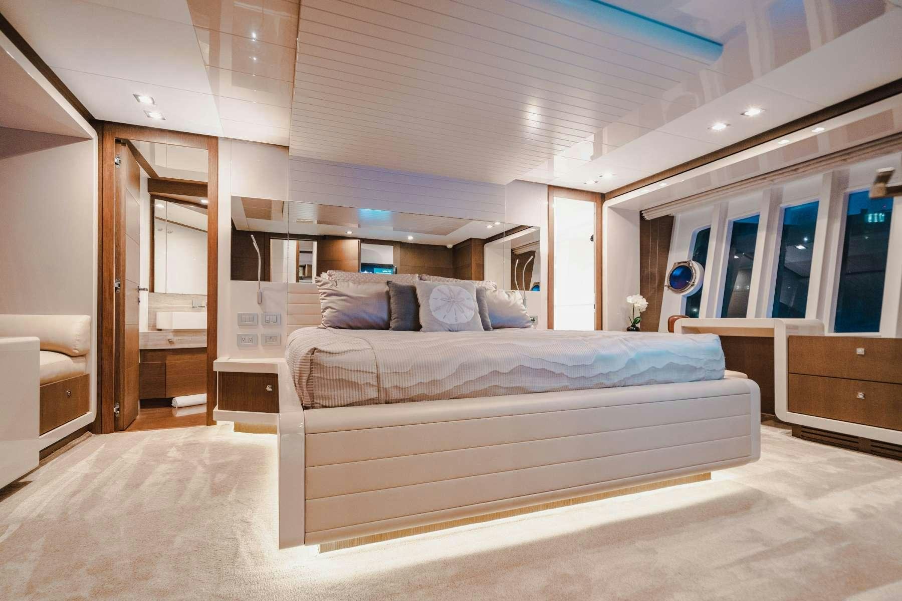 a large bedroom with a large bed aboard MIRABILIS Yacht for Charter