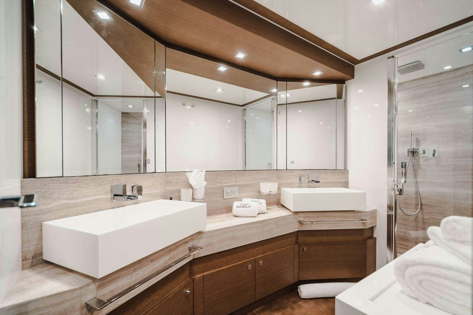 a bathroom with a large mirror aboard MIRABILIS Yacht for Charter