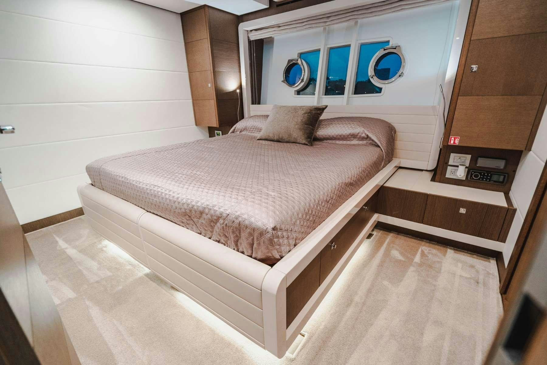 a bed in a room aboard MIRABILIS Yacht for Charter