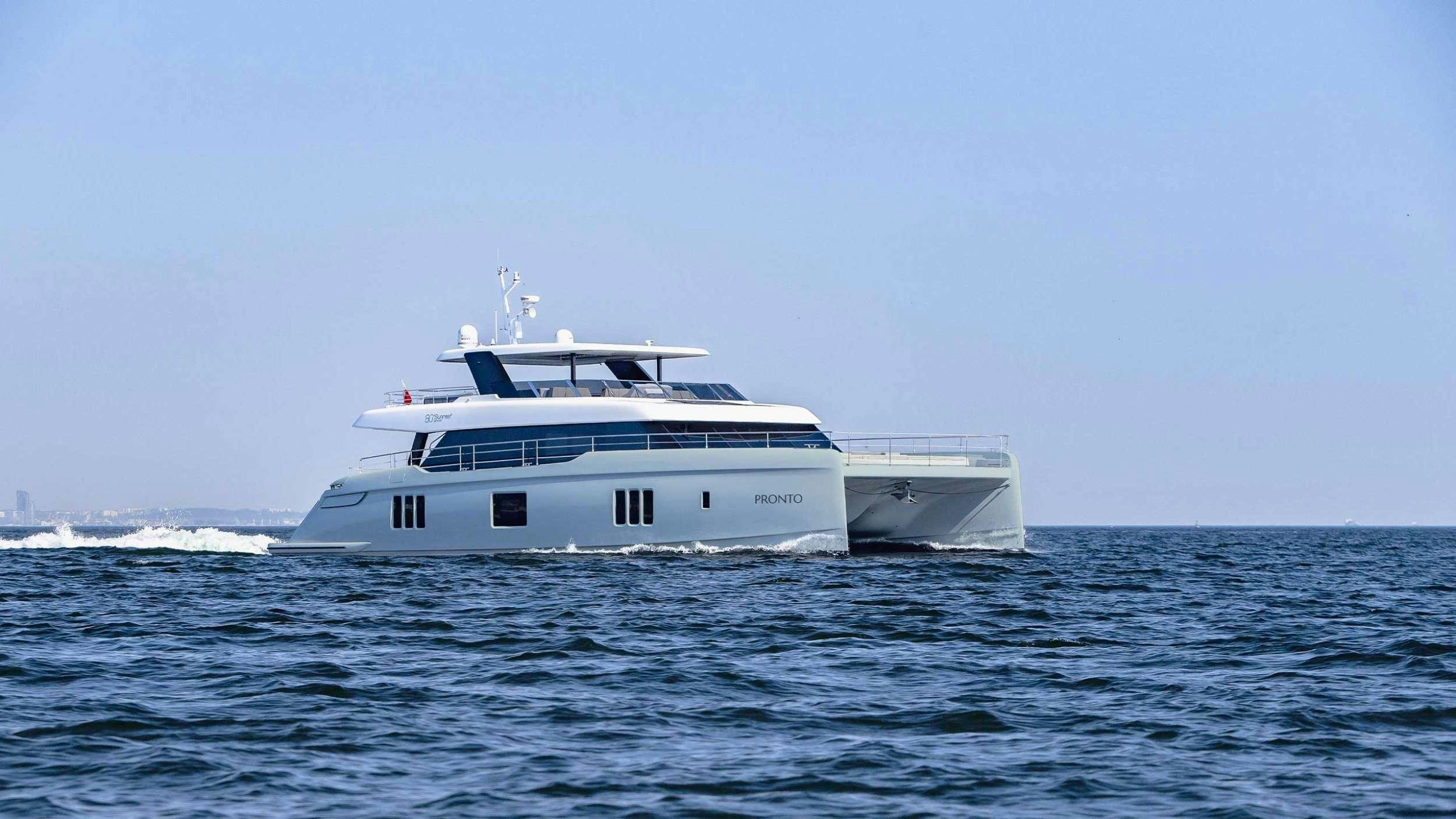 a white boat in the water aboard PRONTO Yacht for Charter