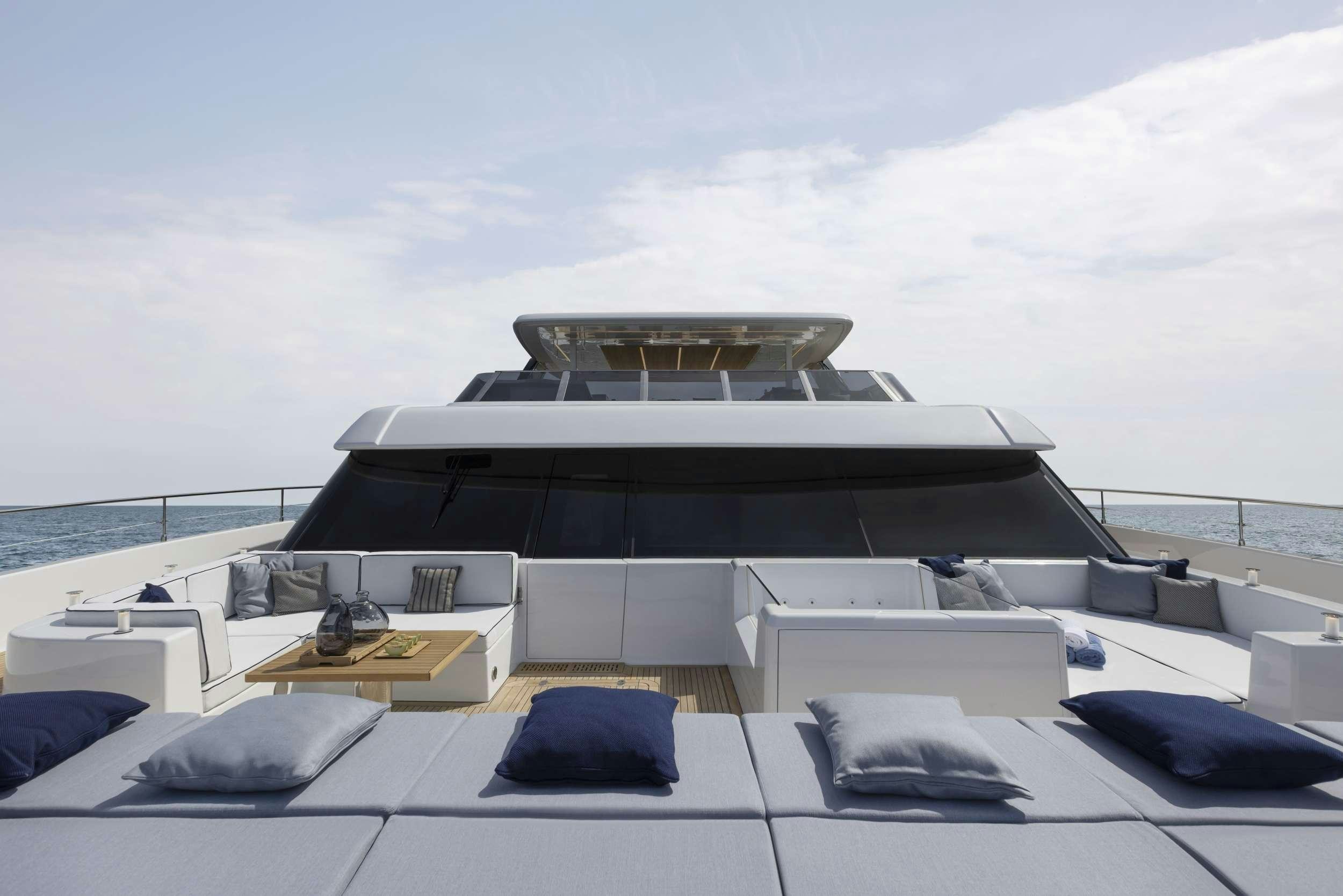 a large white boat on a large body of water aboard PRONTO Yacht for Charter