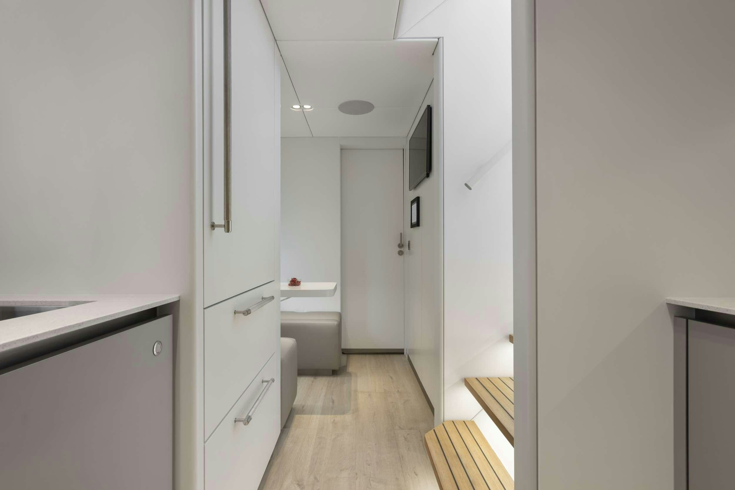 a hallway with a sink and cabinets aboard PRONTO Yacht for Charter