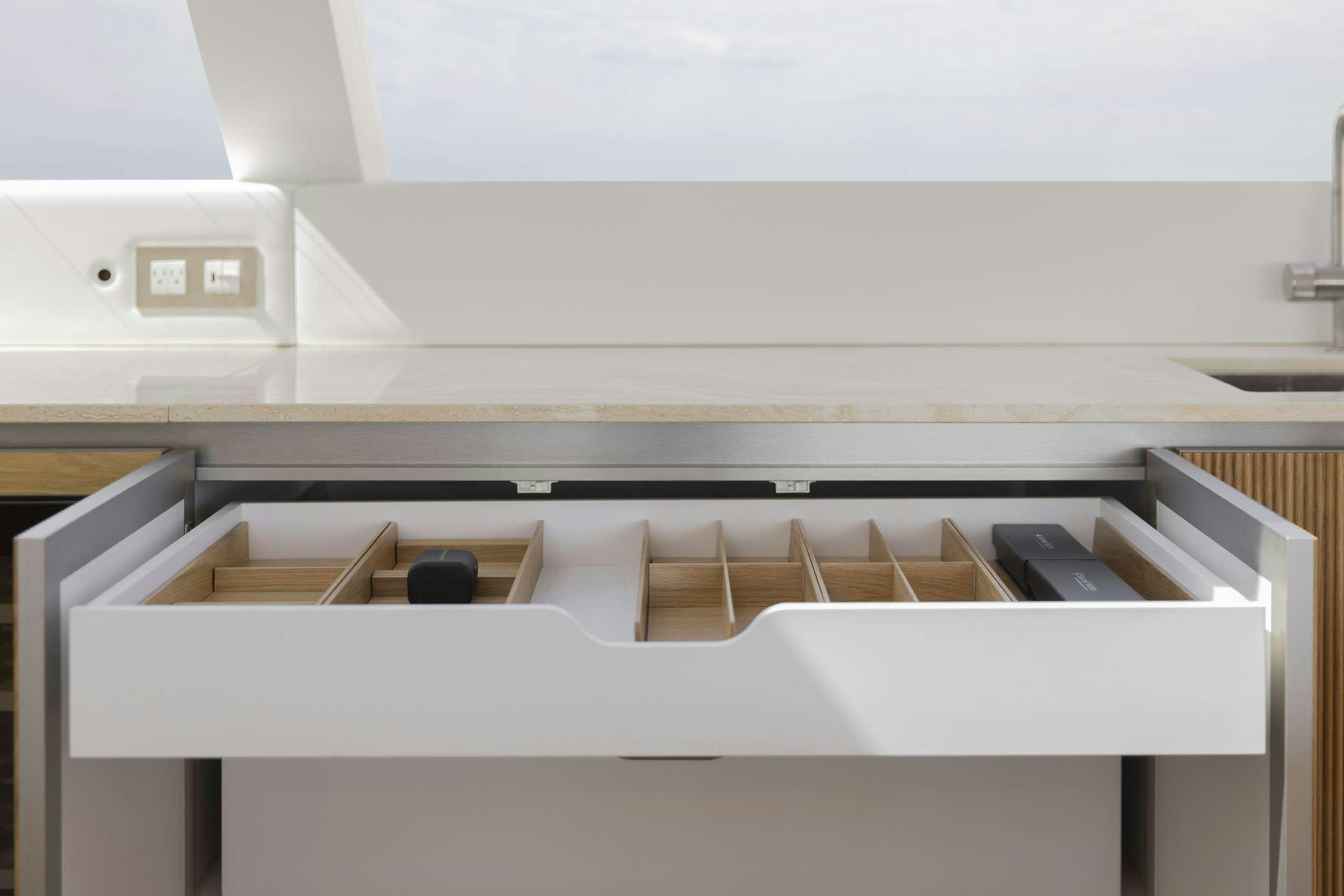 a white rectangular object with a black object on it aboard PRONTO Yacht for Charter